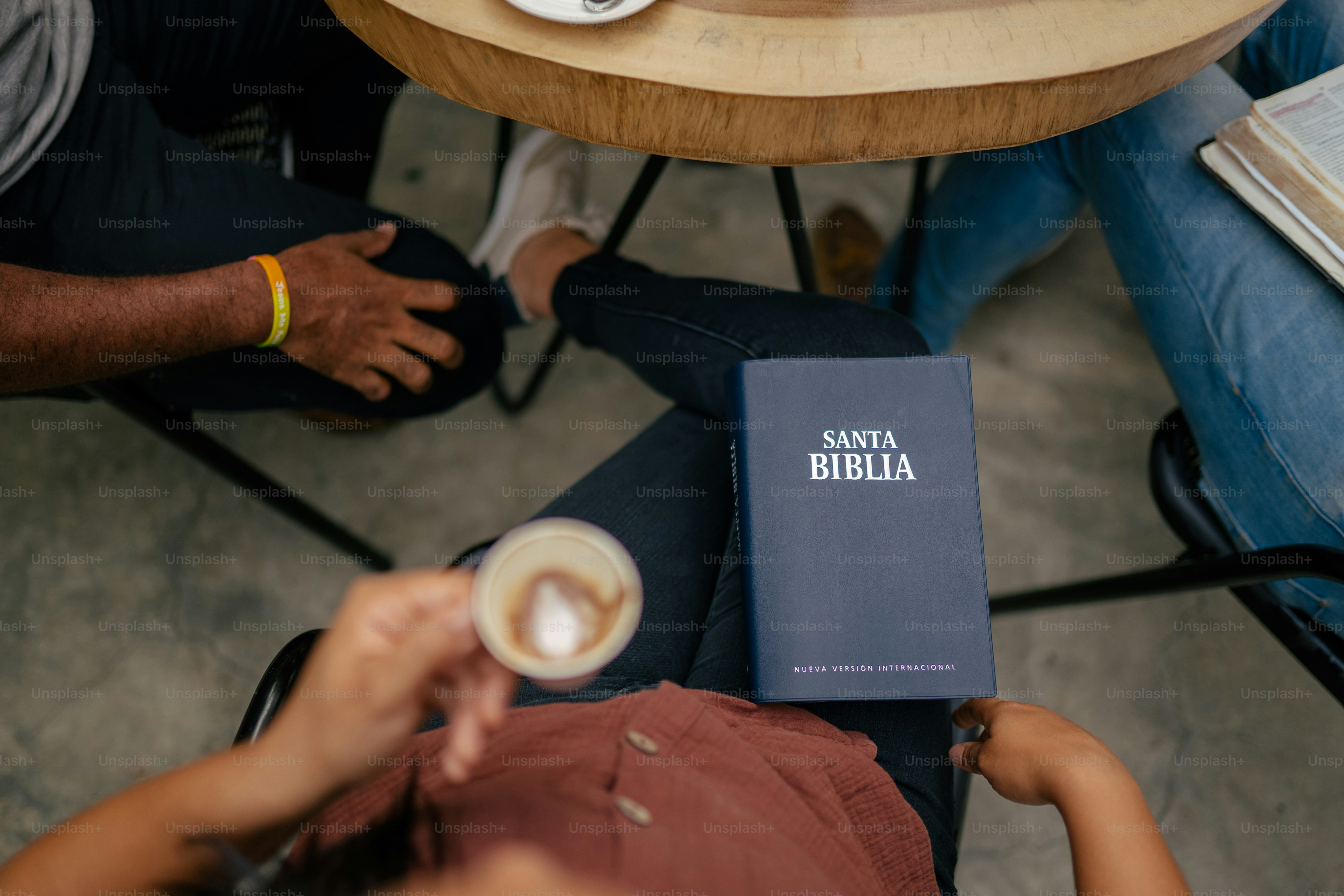 a person sitting at a table with a book