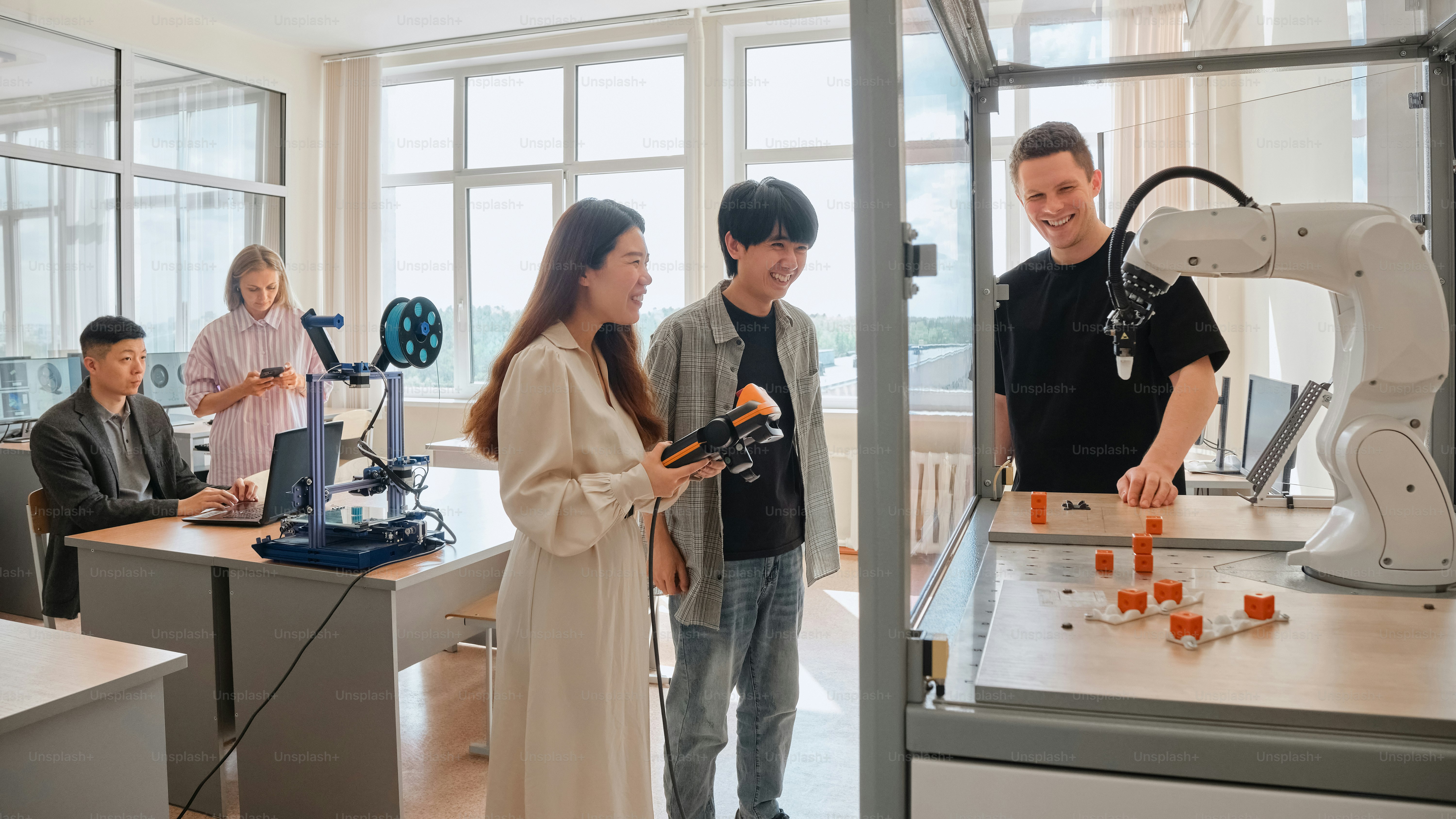 a group of people standing around a microscope