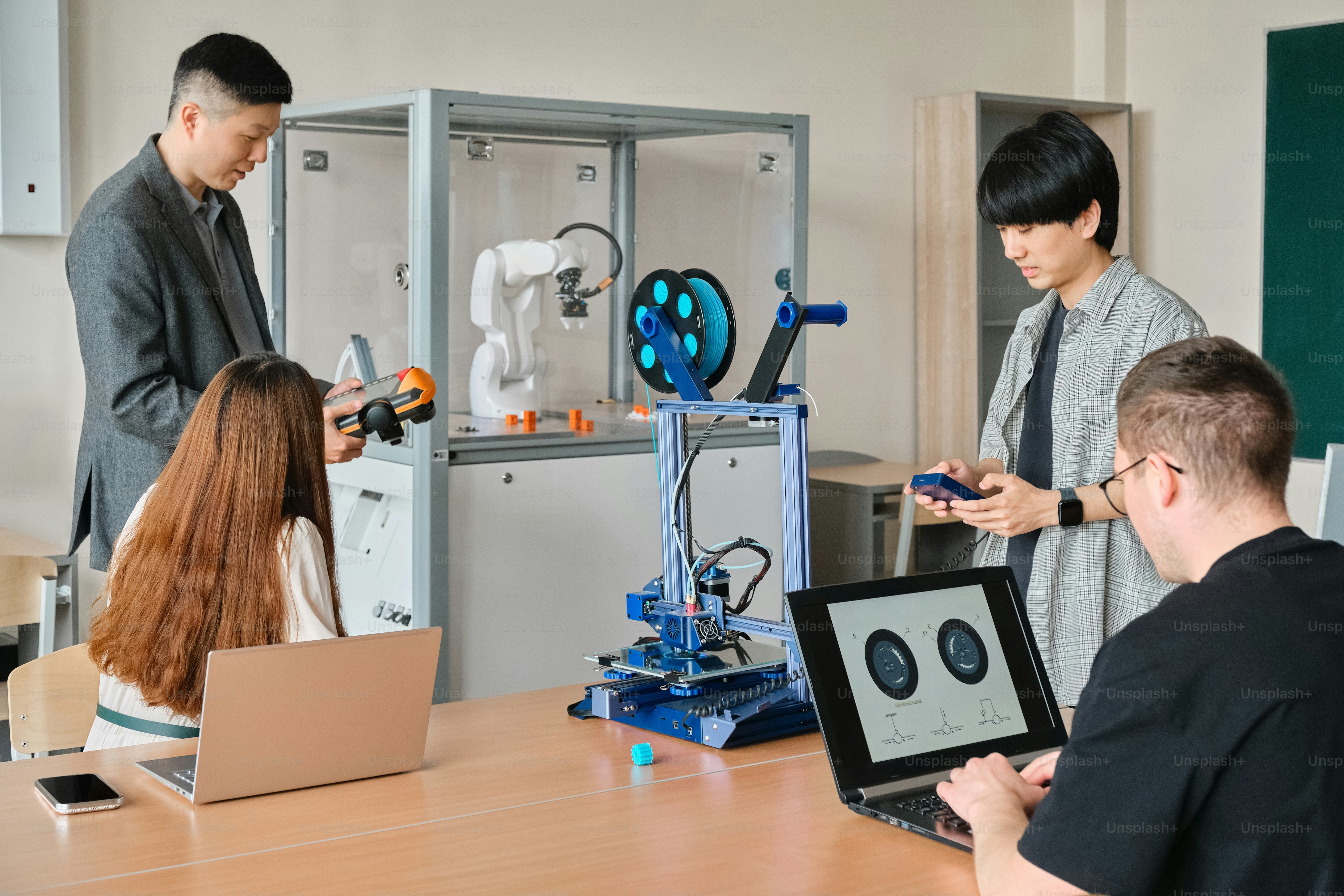 a group of people standing around a table
