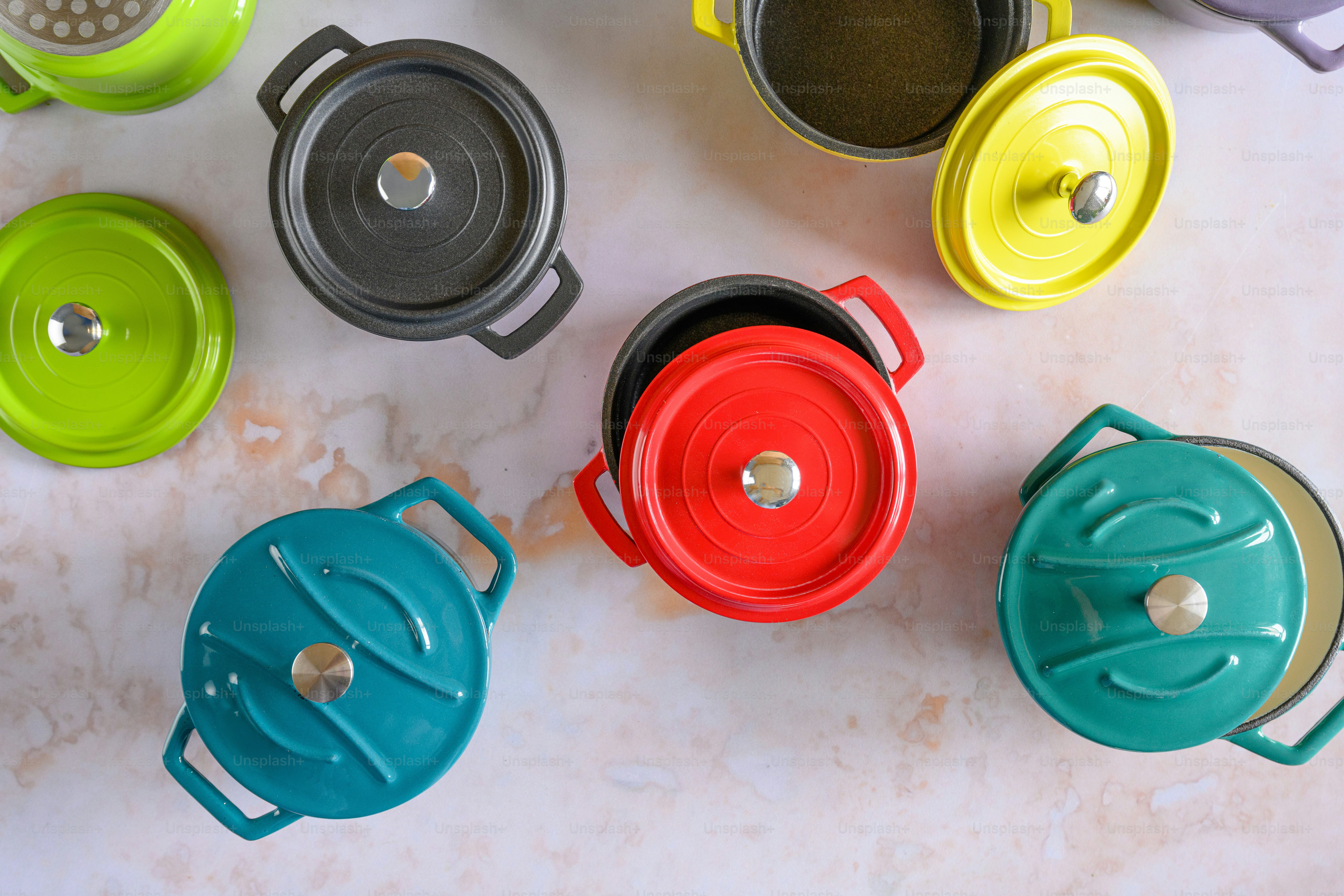 a group of colorful cups sitting on top of a table