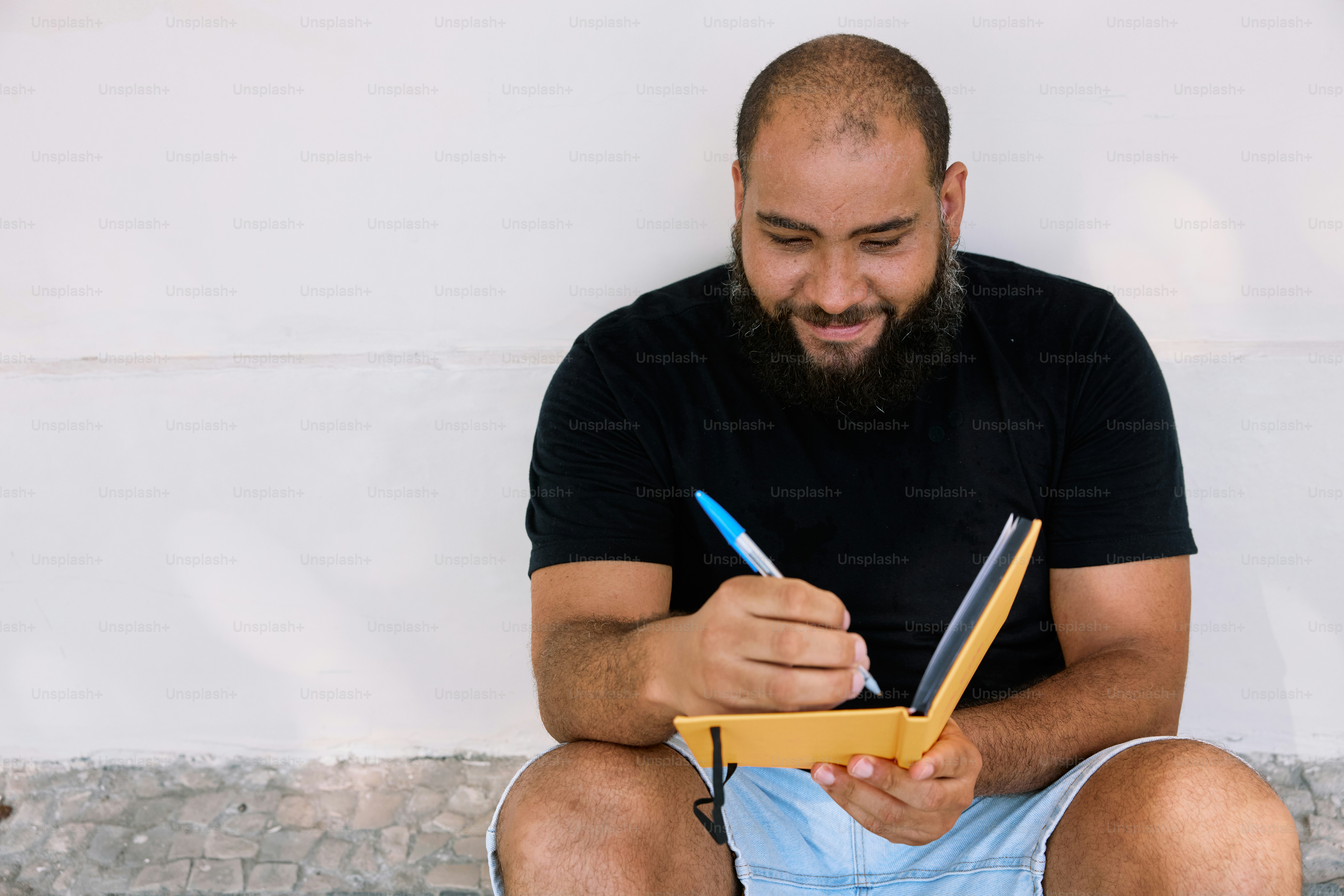 Athlete performing a fitness goal review using workout notes and progress data