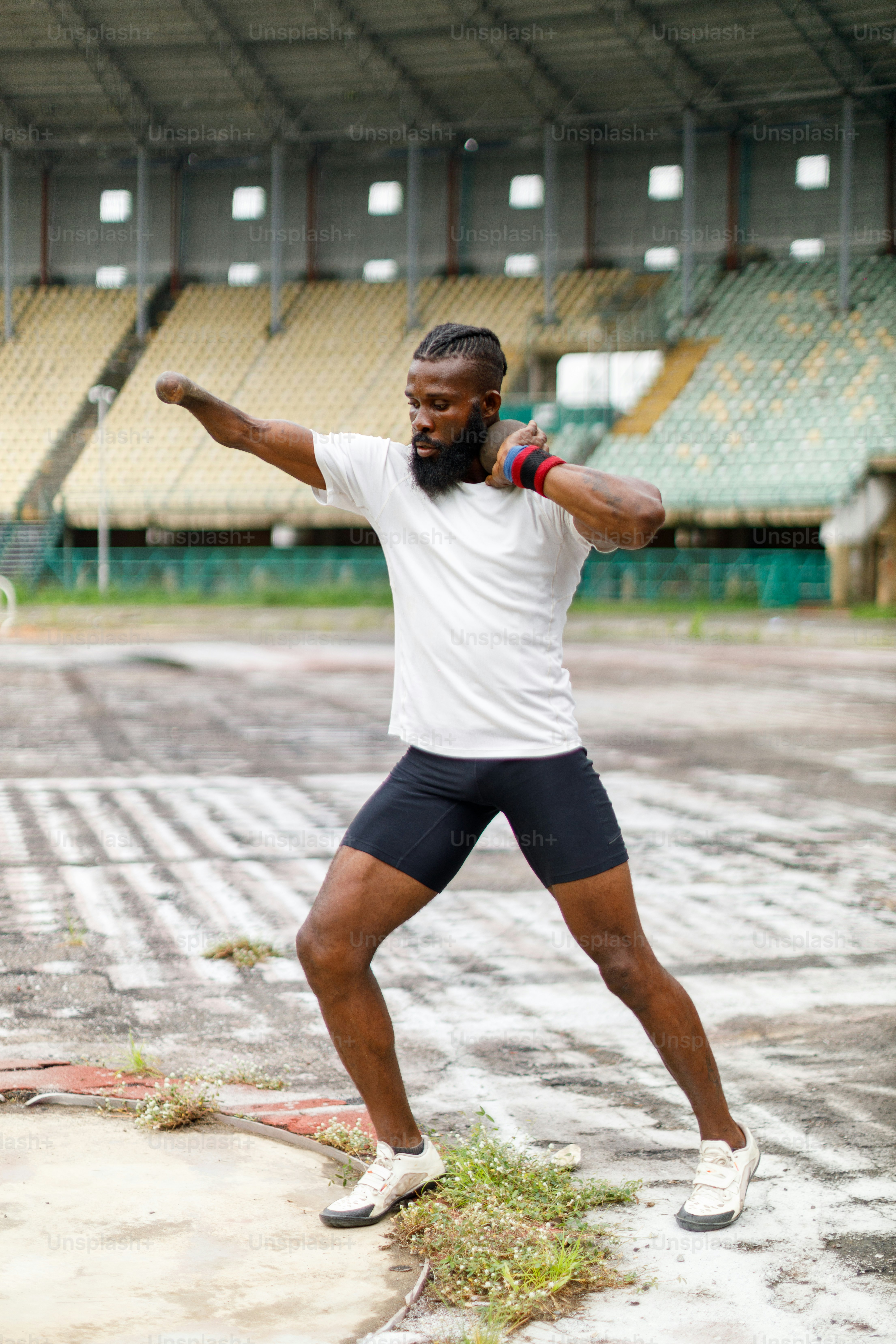 a man standing on a tennis court holding a racquet
