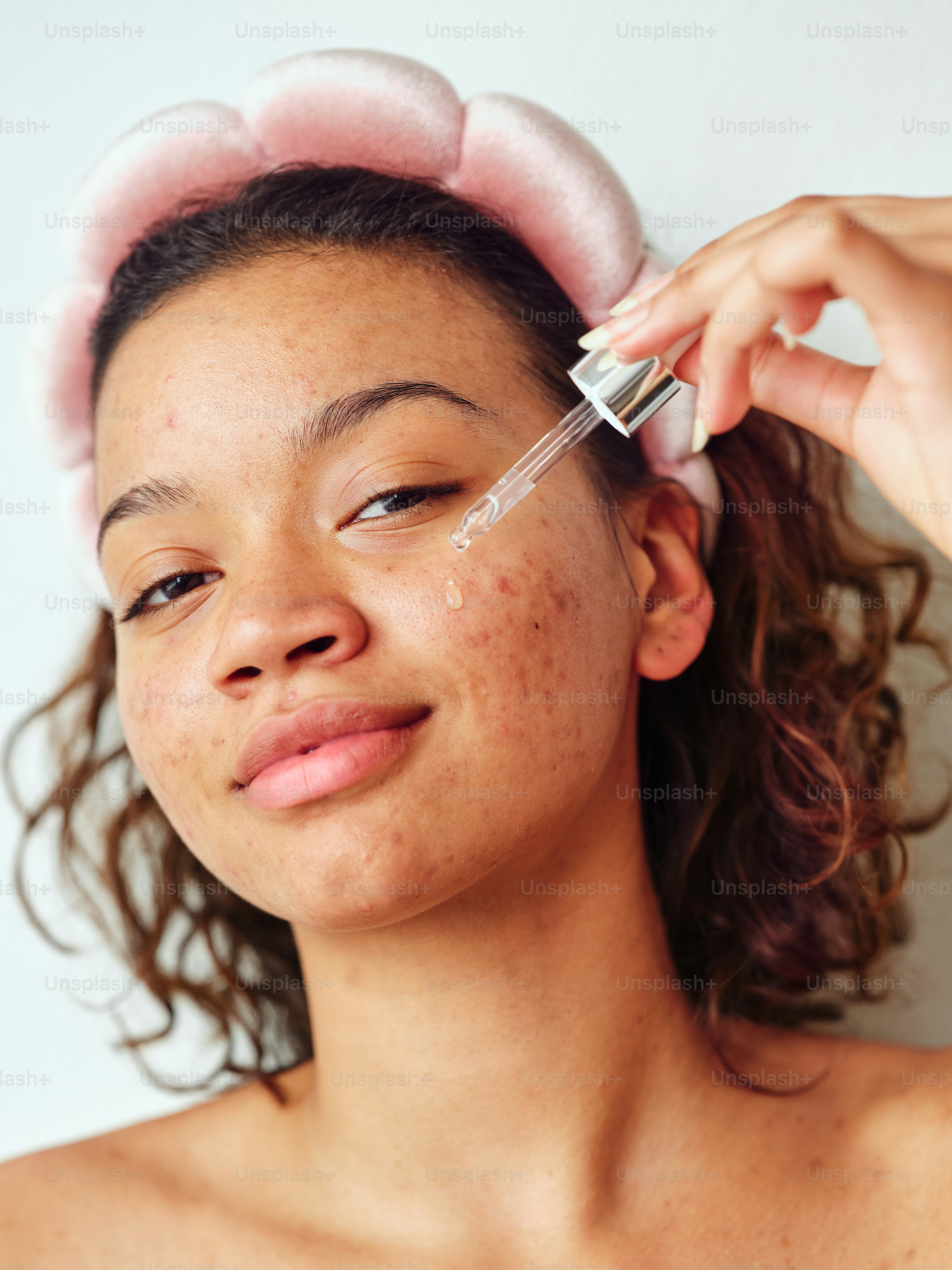 a woman getting her hair brushed with a brush
