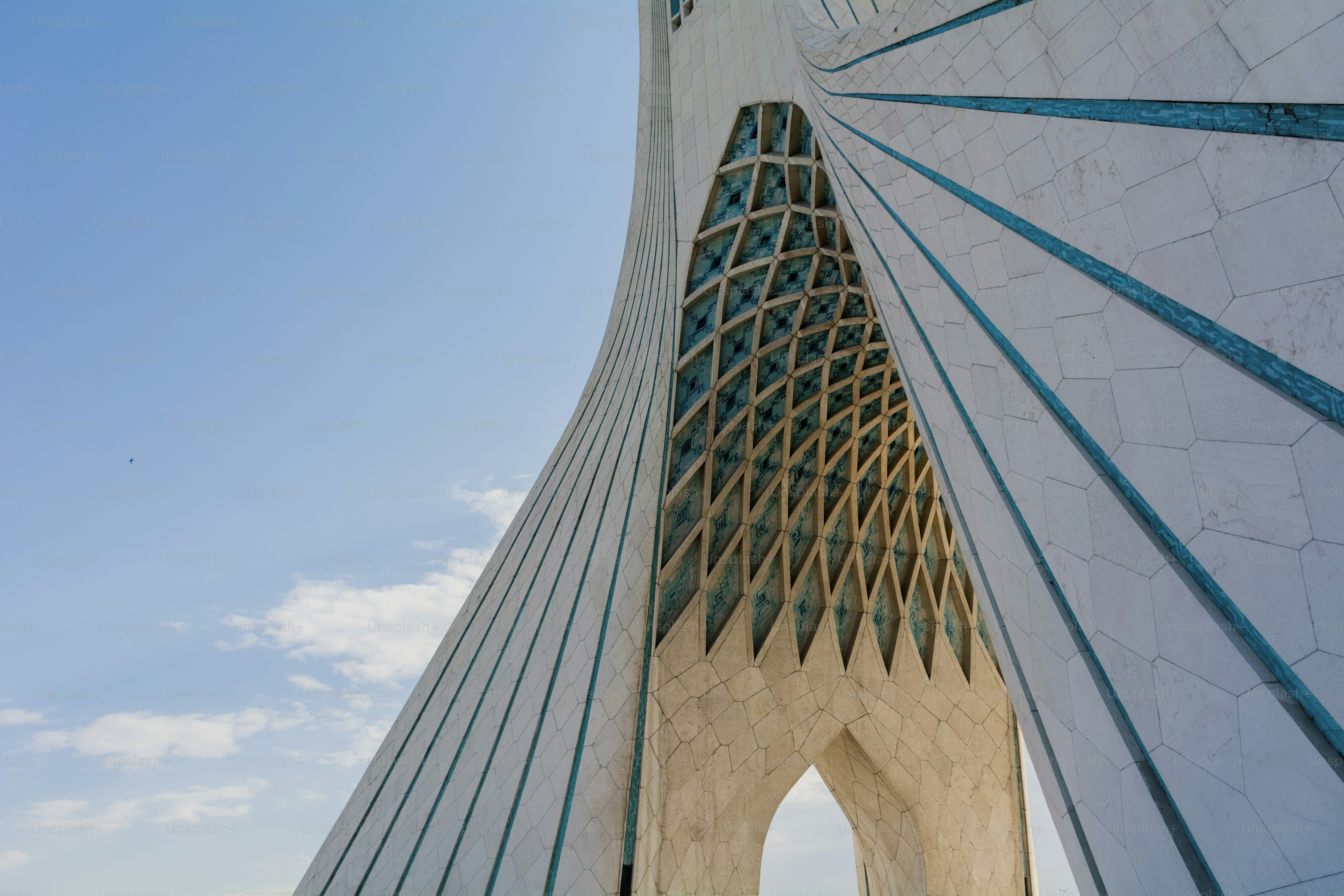 a very tall building with a sky in the background