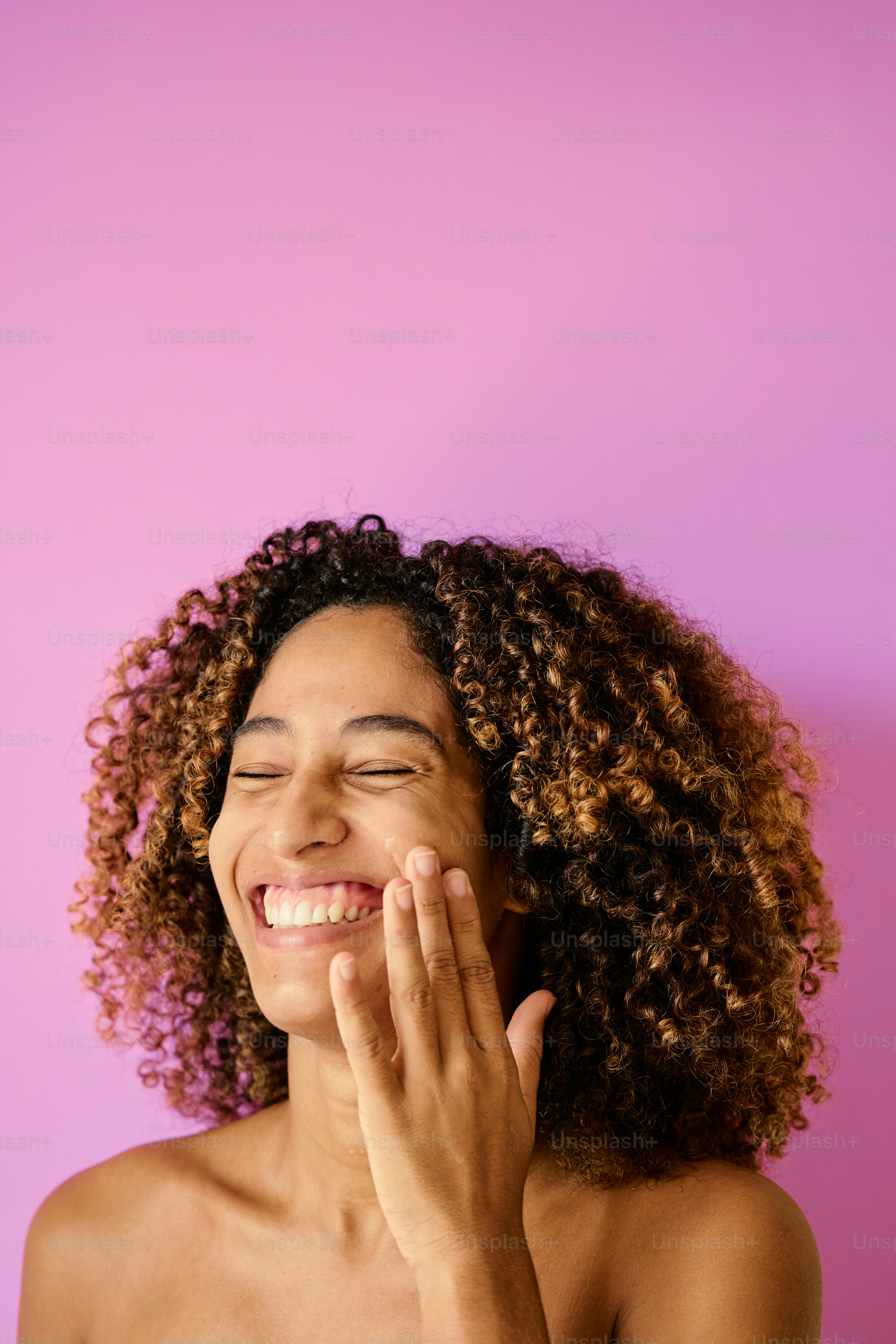 A close up of a woman smiling with her hands on her chest photo ...