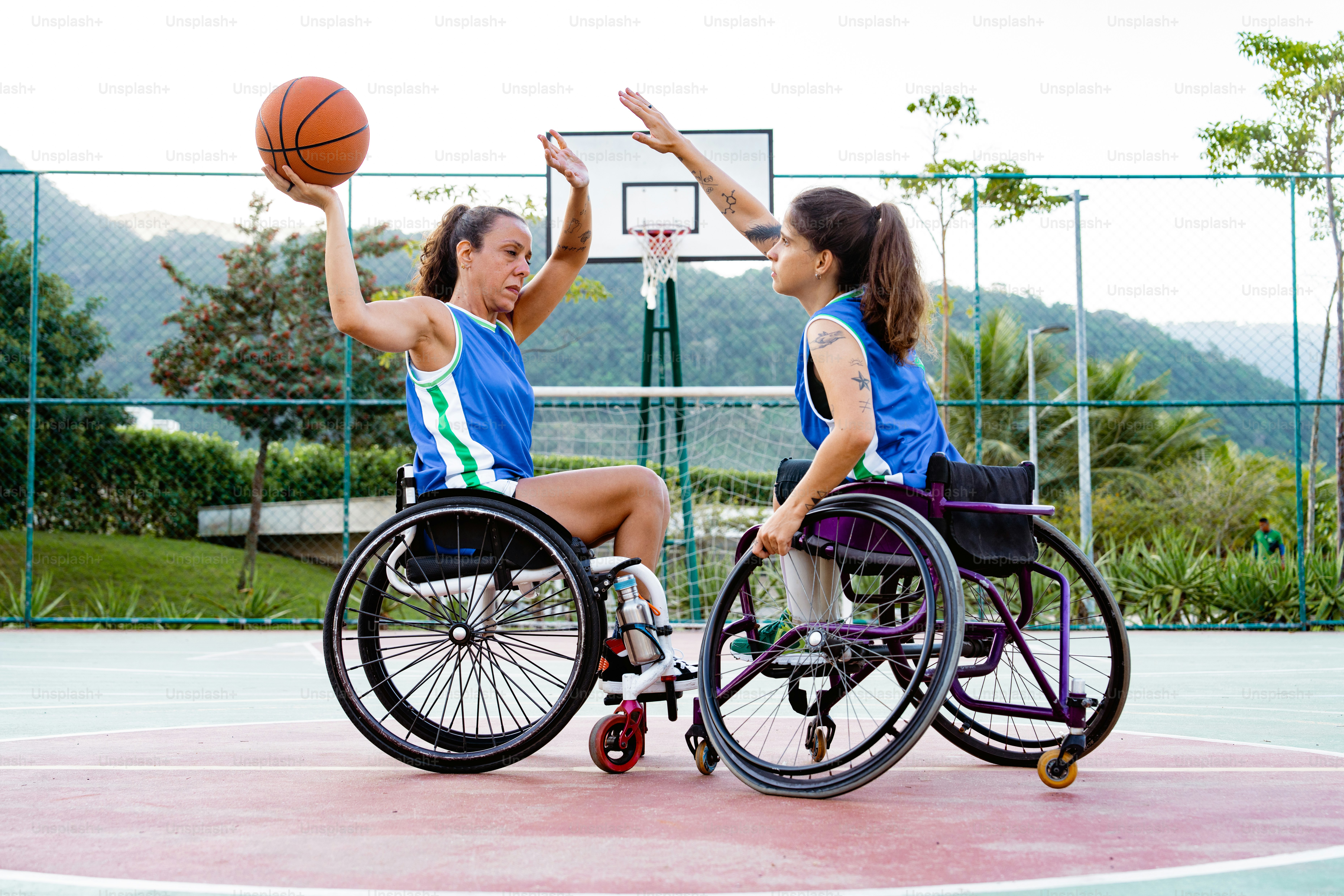A woman in a wheel chair holding a basketball photo – Basketball Image ...