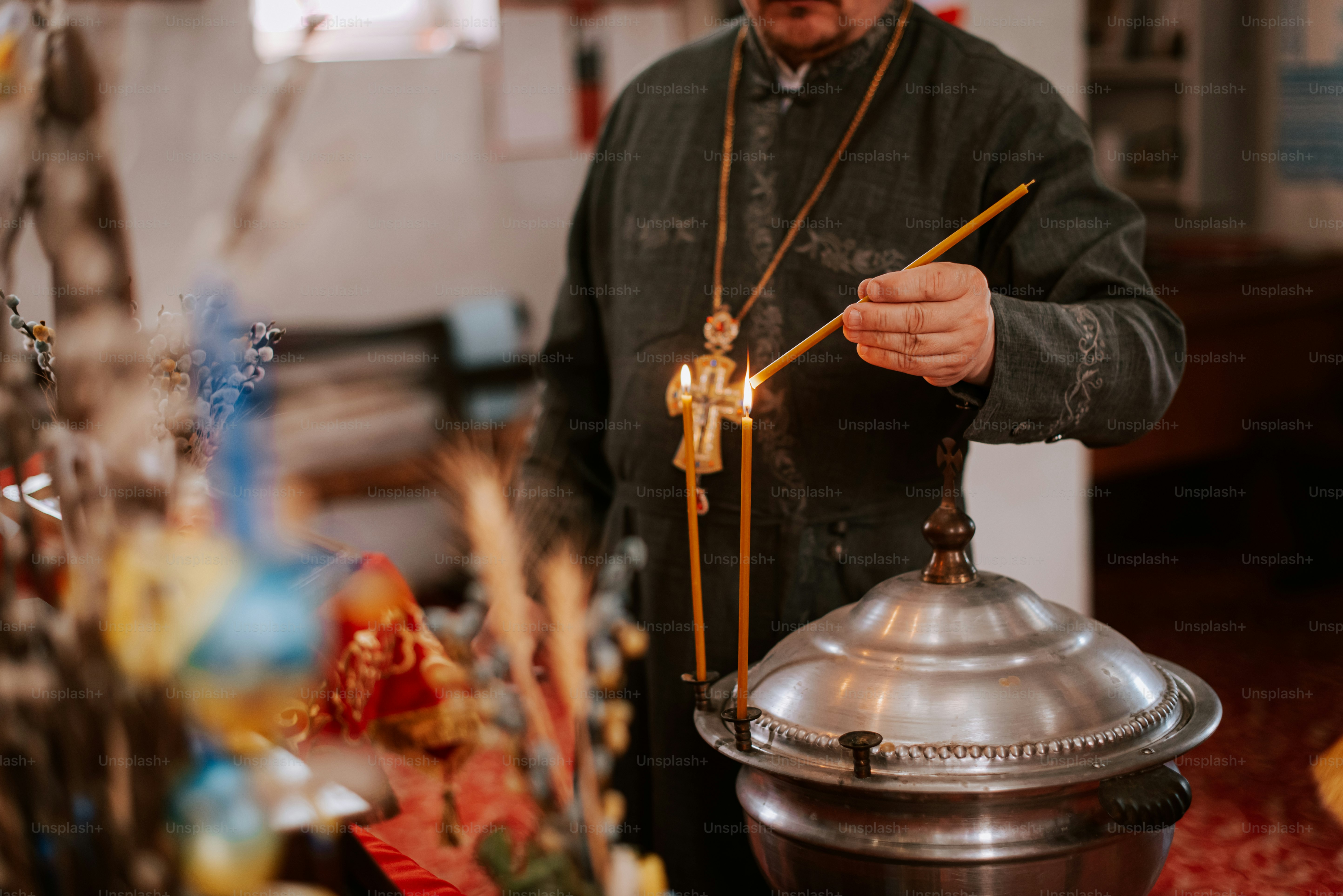 a man standing in front of a metal pot