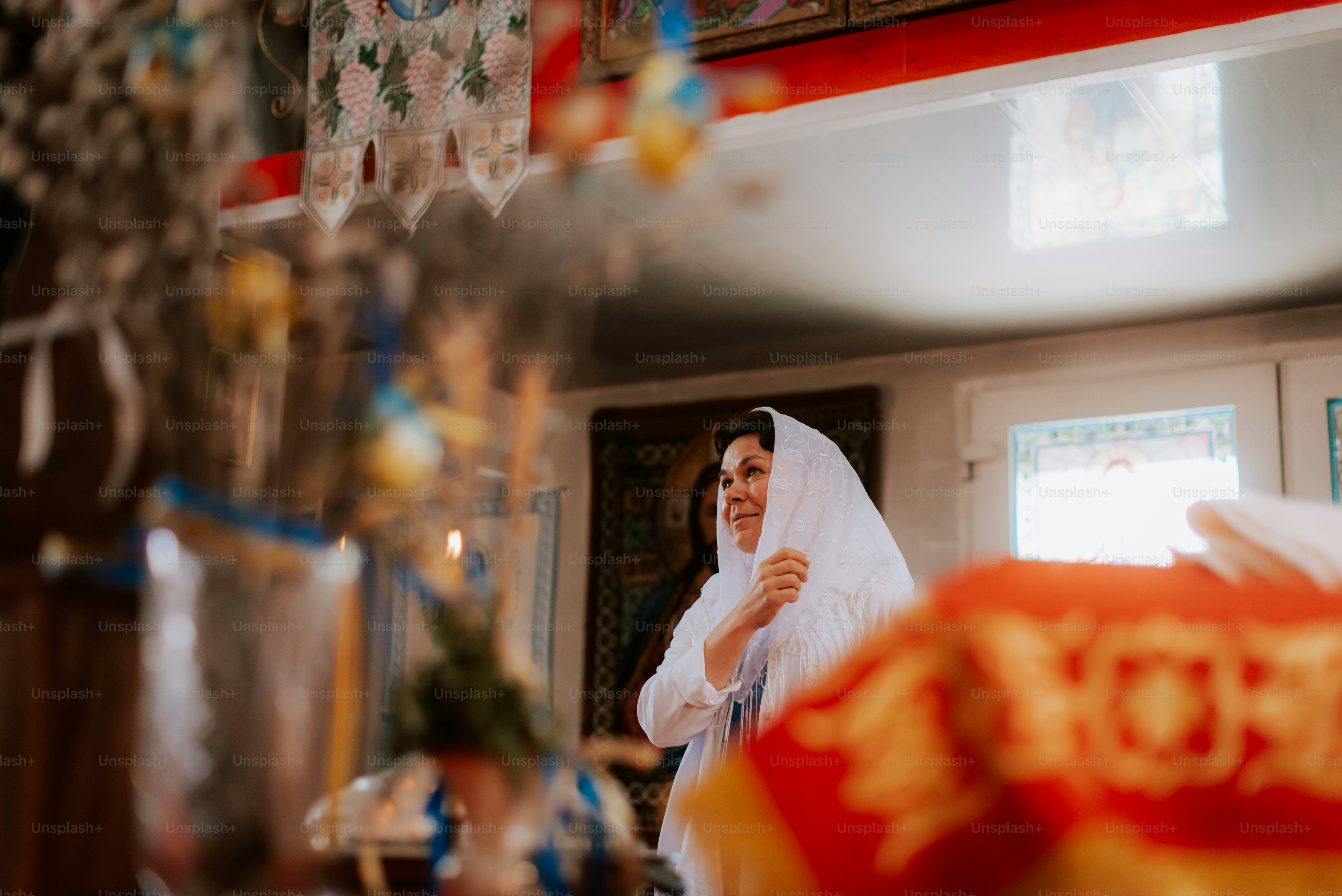 A woman in a white veil standing in front of a mirror photo – Church ...