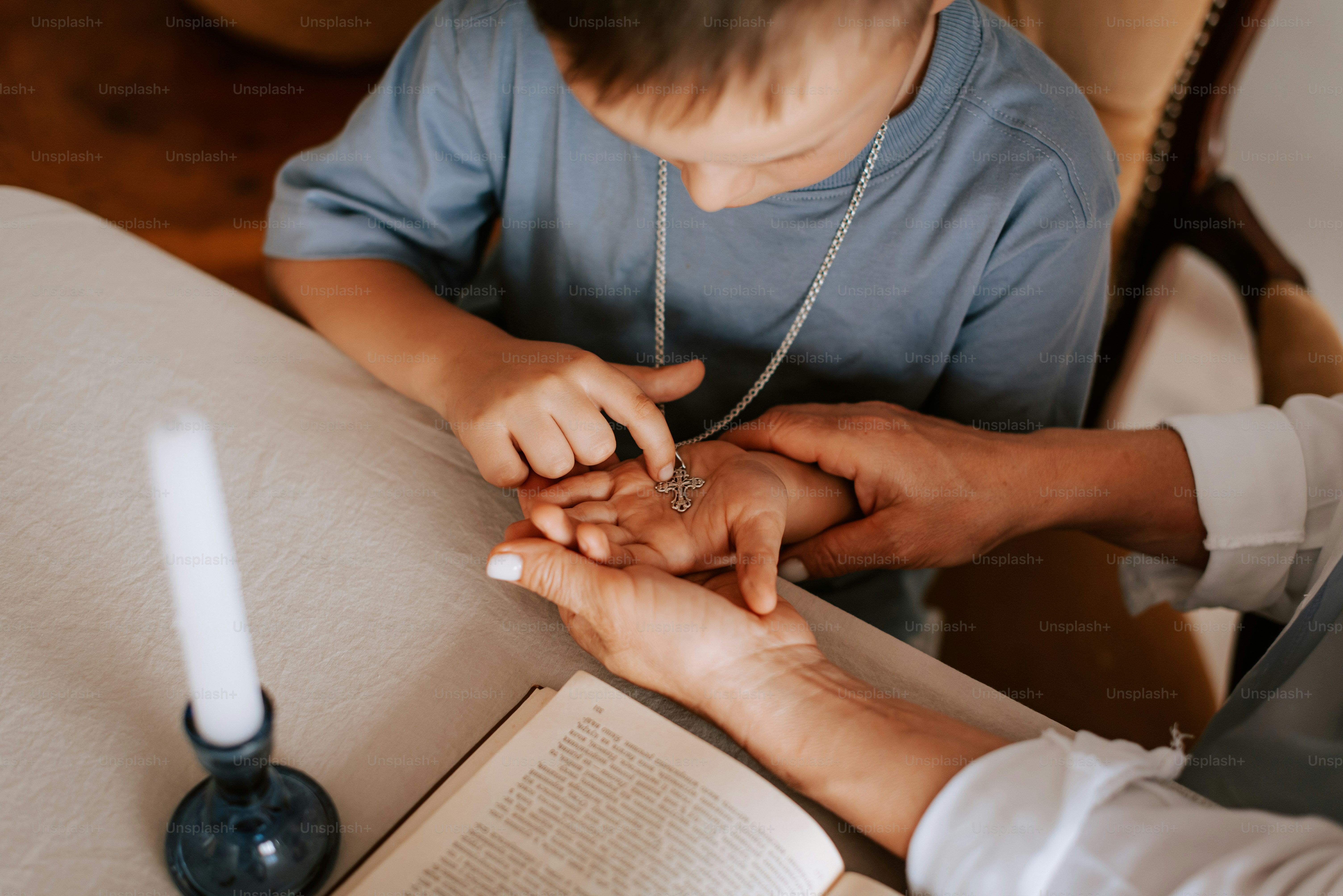 a man and a woman holding hands over a book