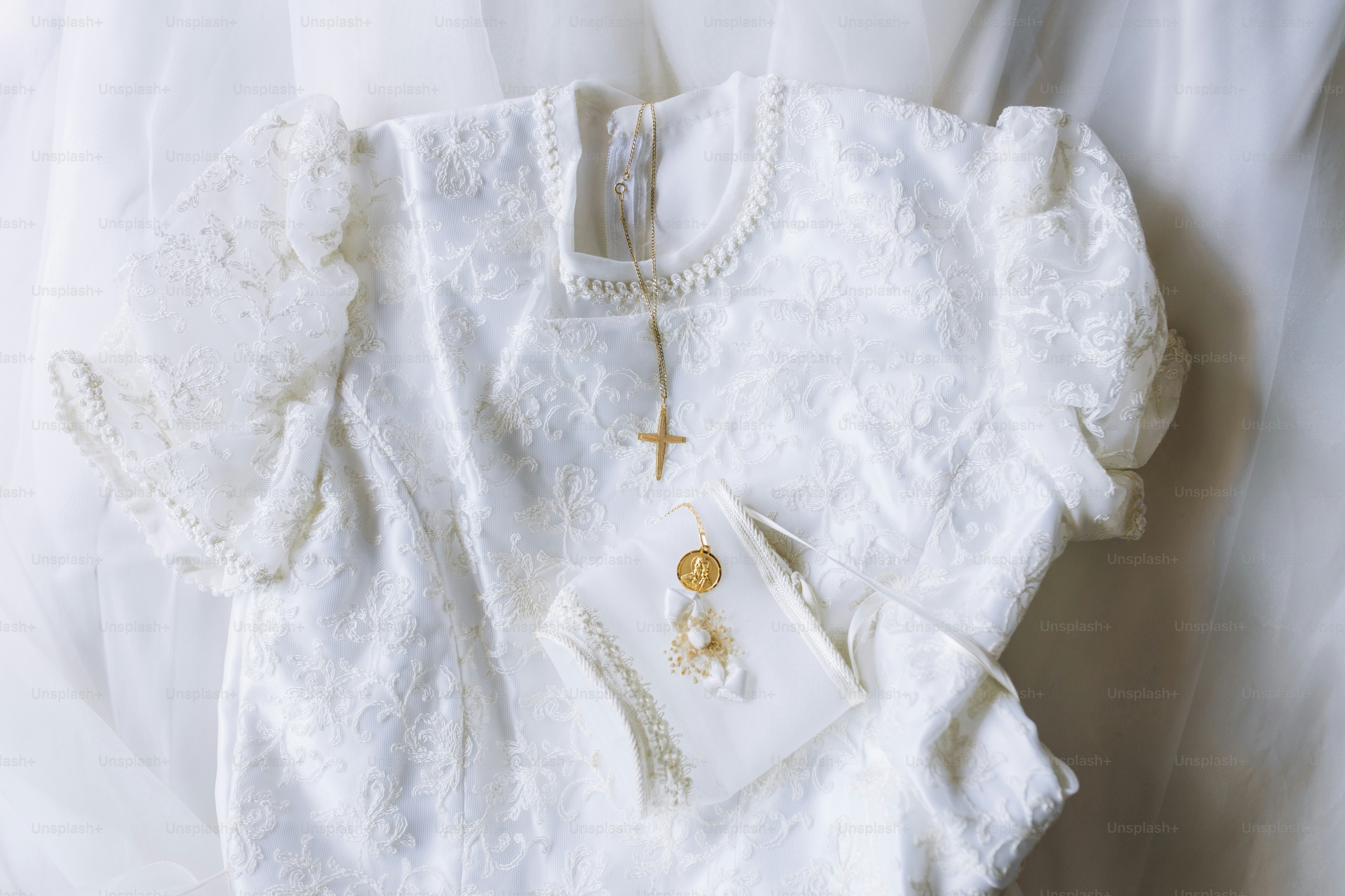 a white shirt with a cross on it