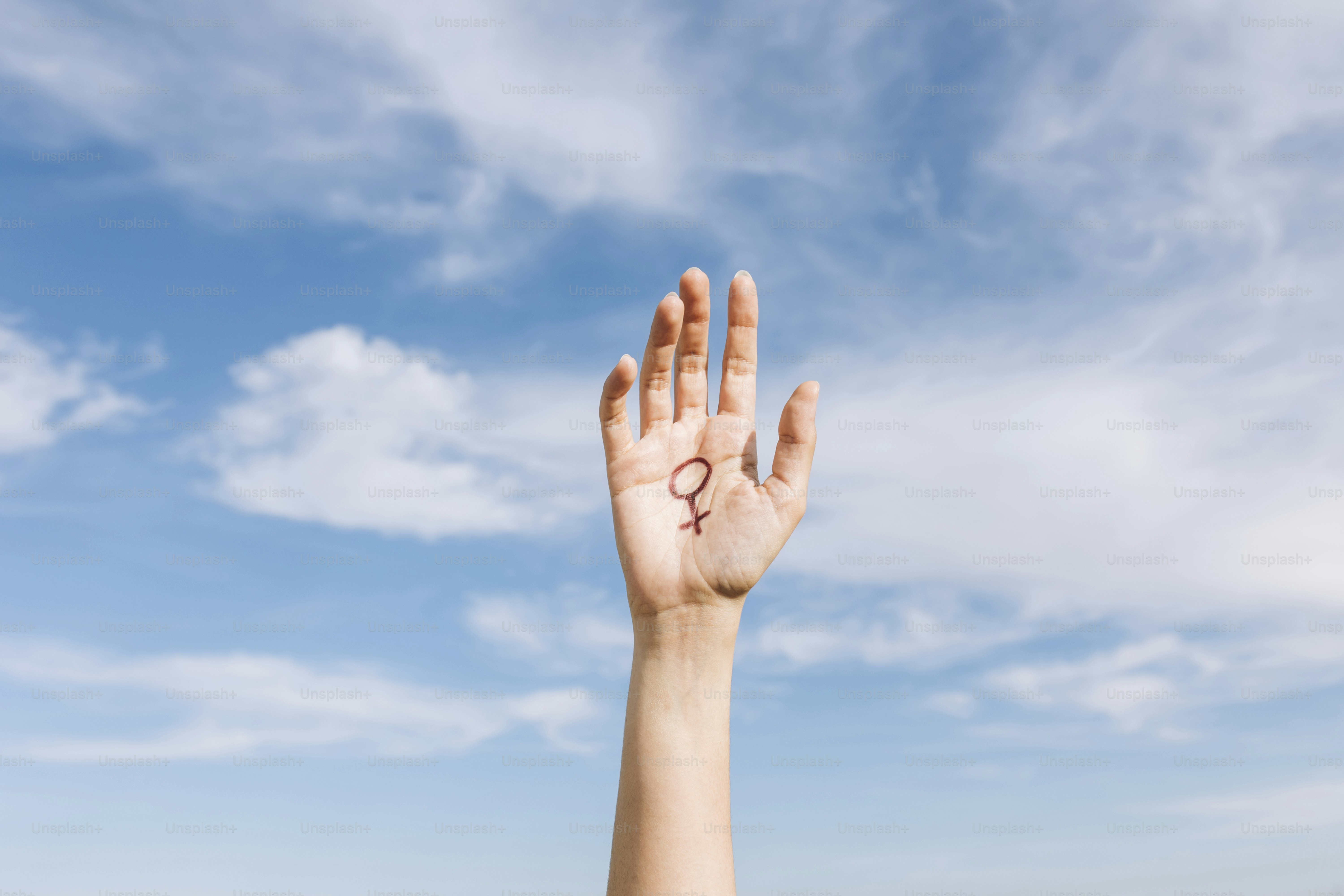 a person's hand with the letter k written on it