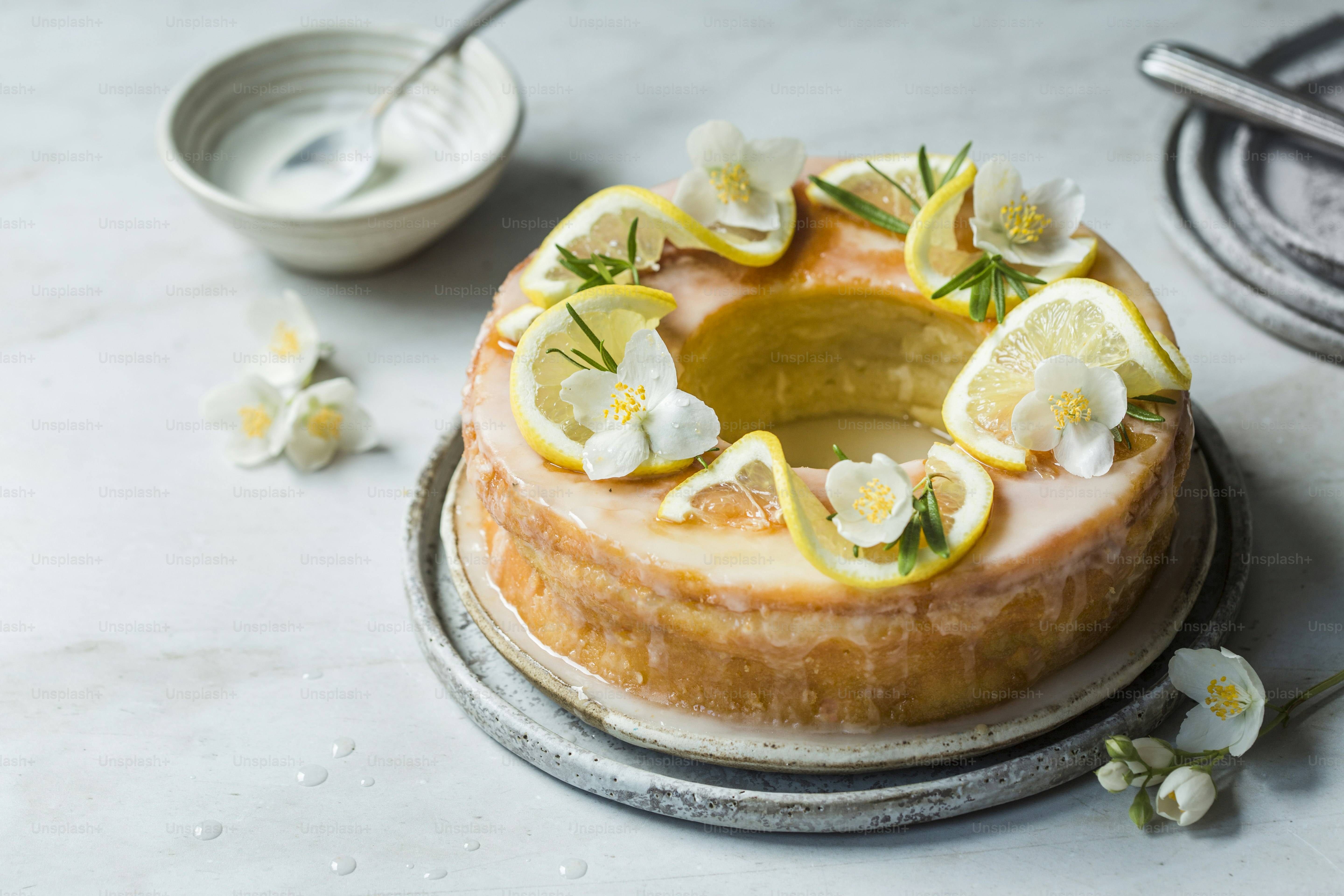a cake with lemon slices and flowers on top