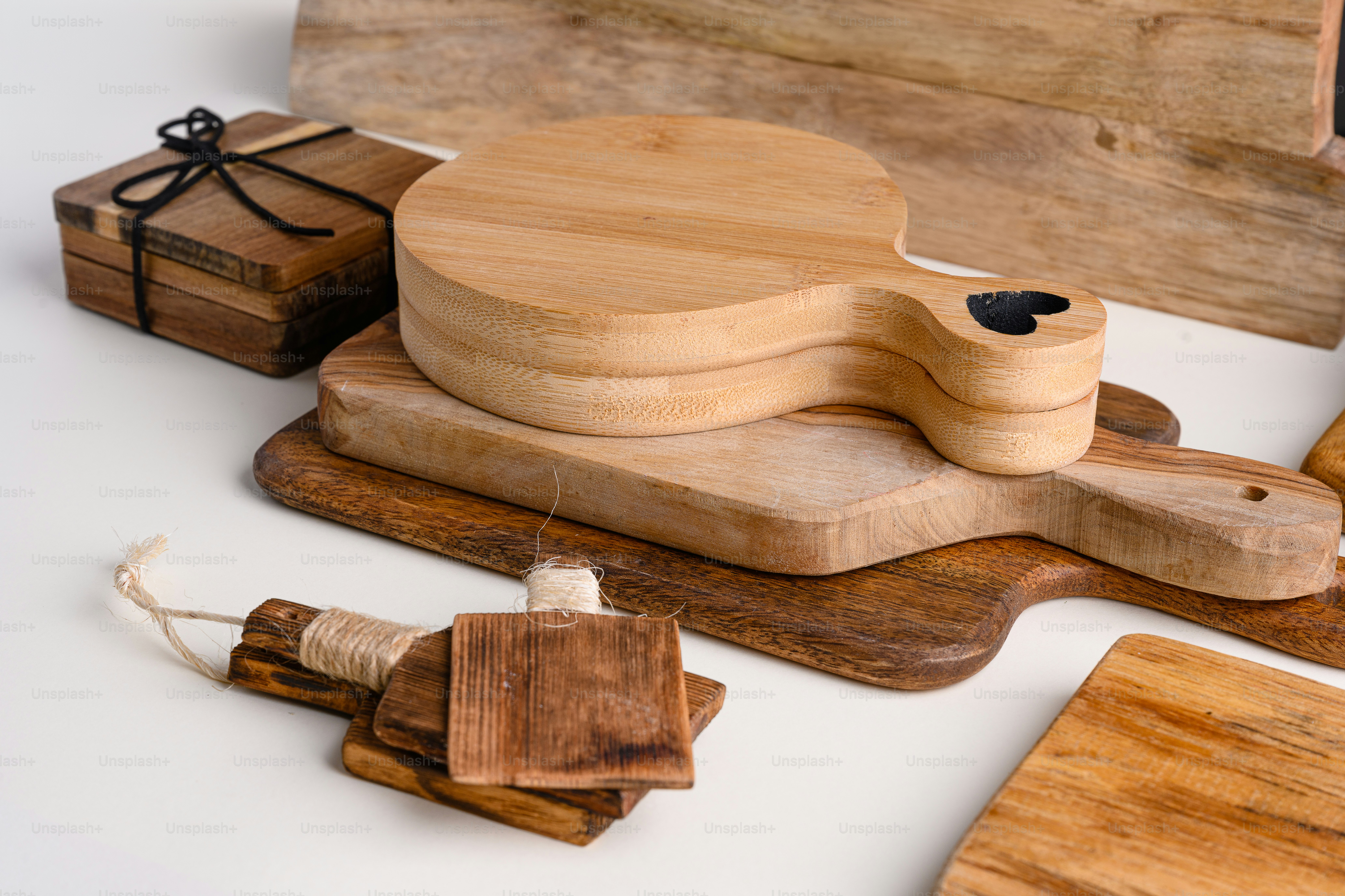 a wooden toy guitar sitting on top of a cutting board
