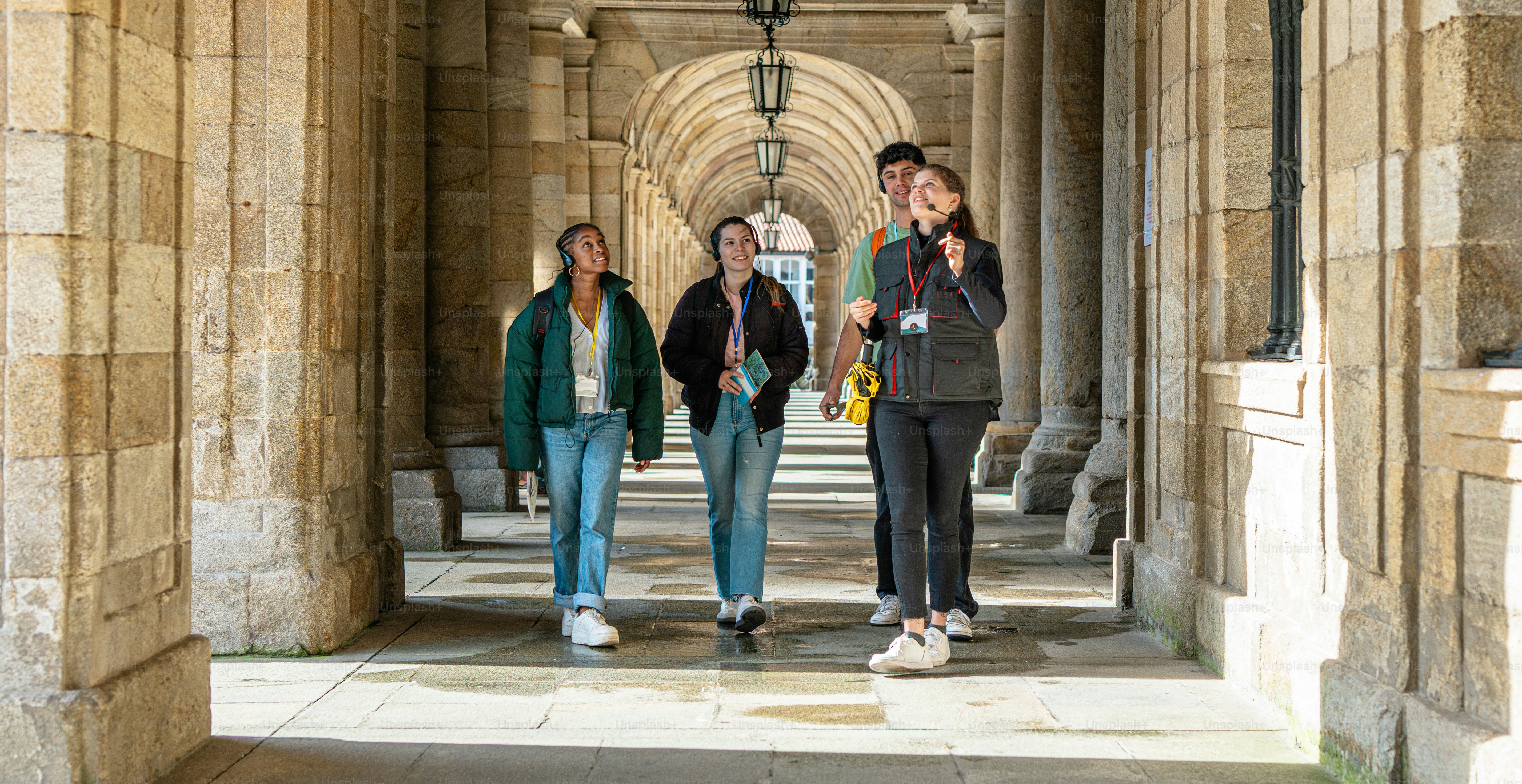 a group of people walking down a walkway