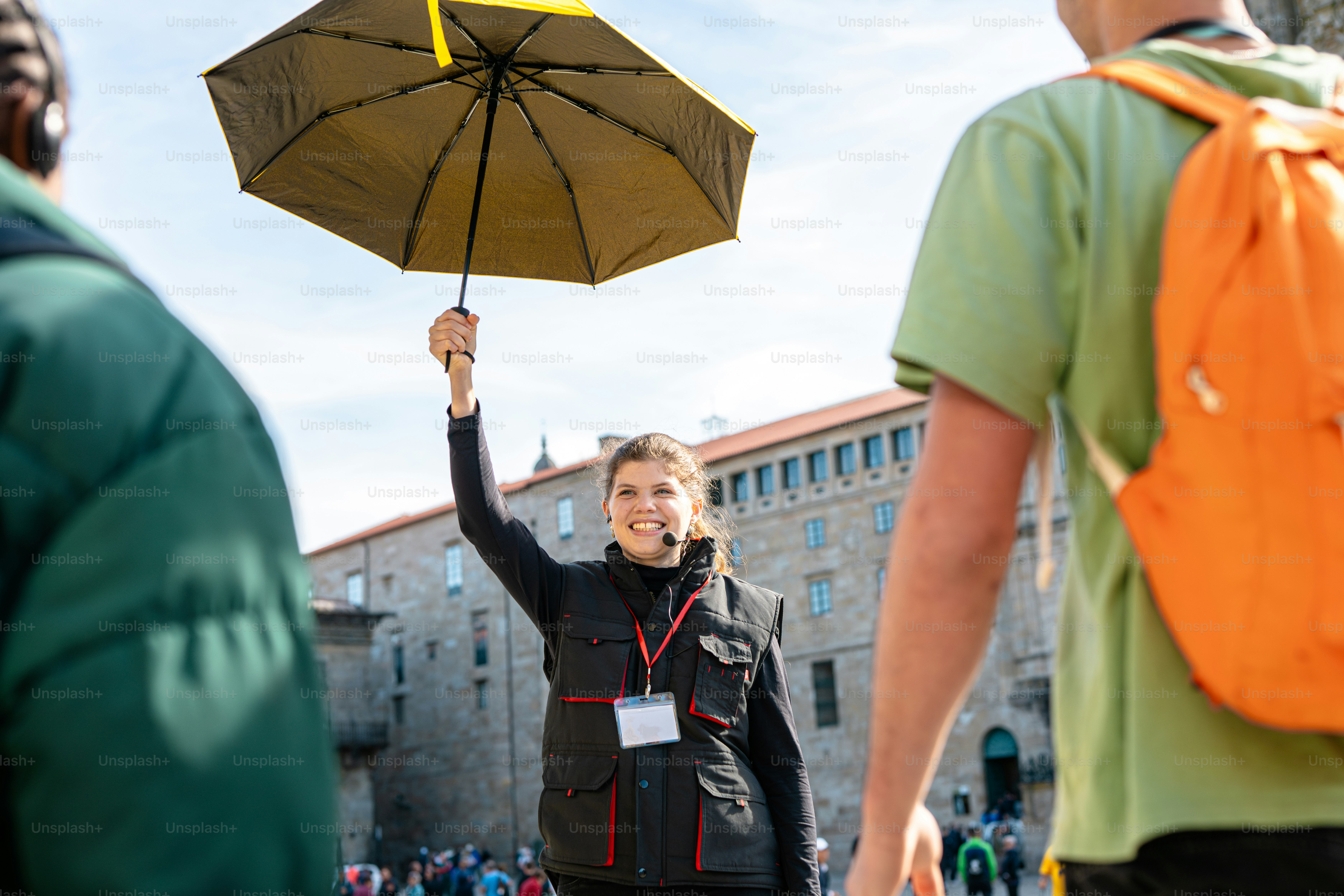 a woman holding an umbrella over her head