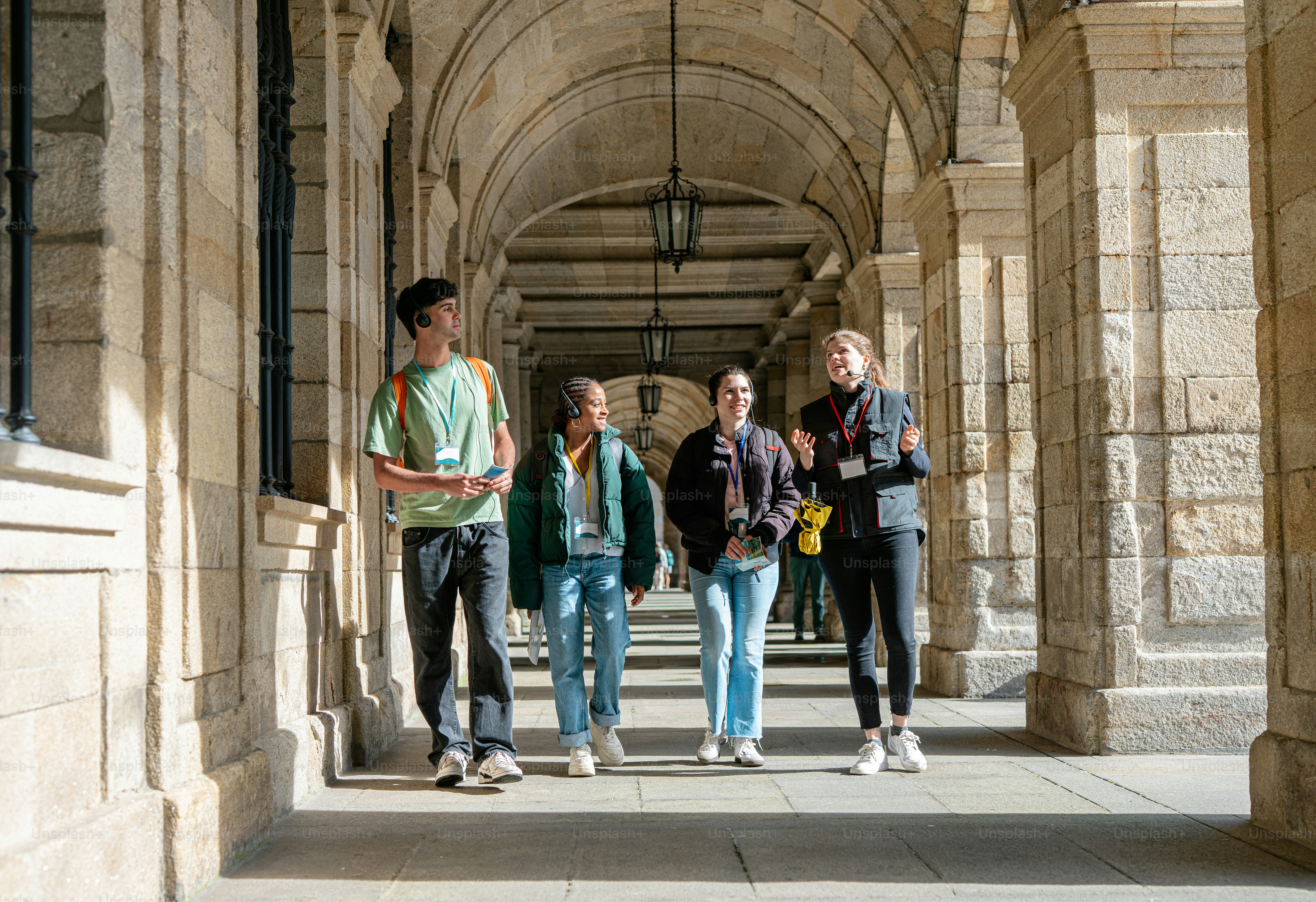 a group of young people walking down a hallway