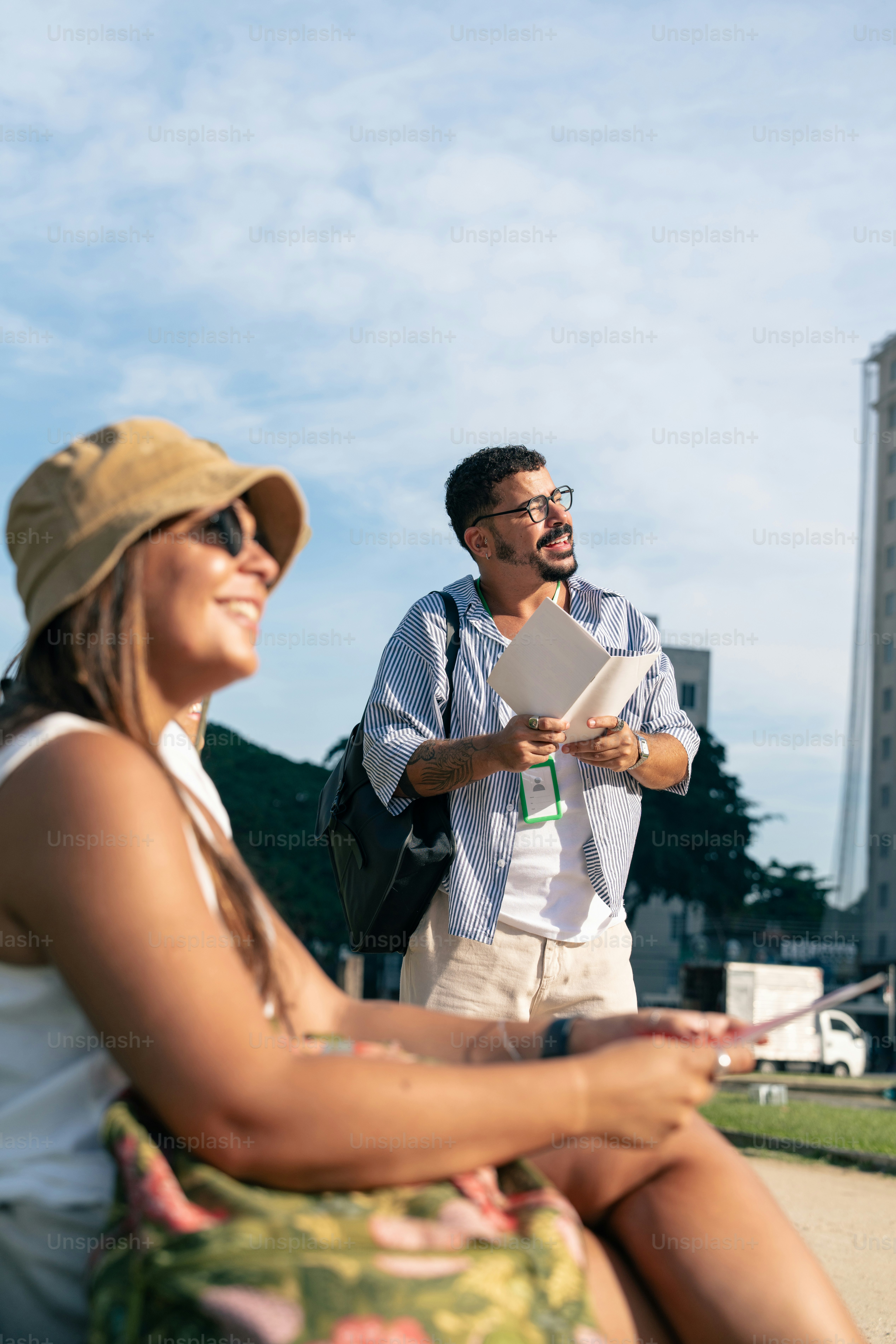 a man and a woman sitting on a bench