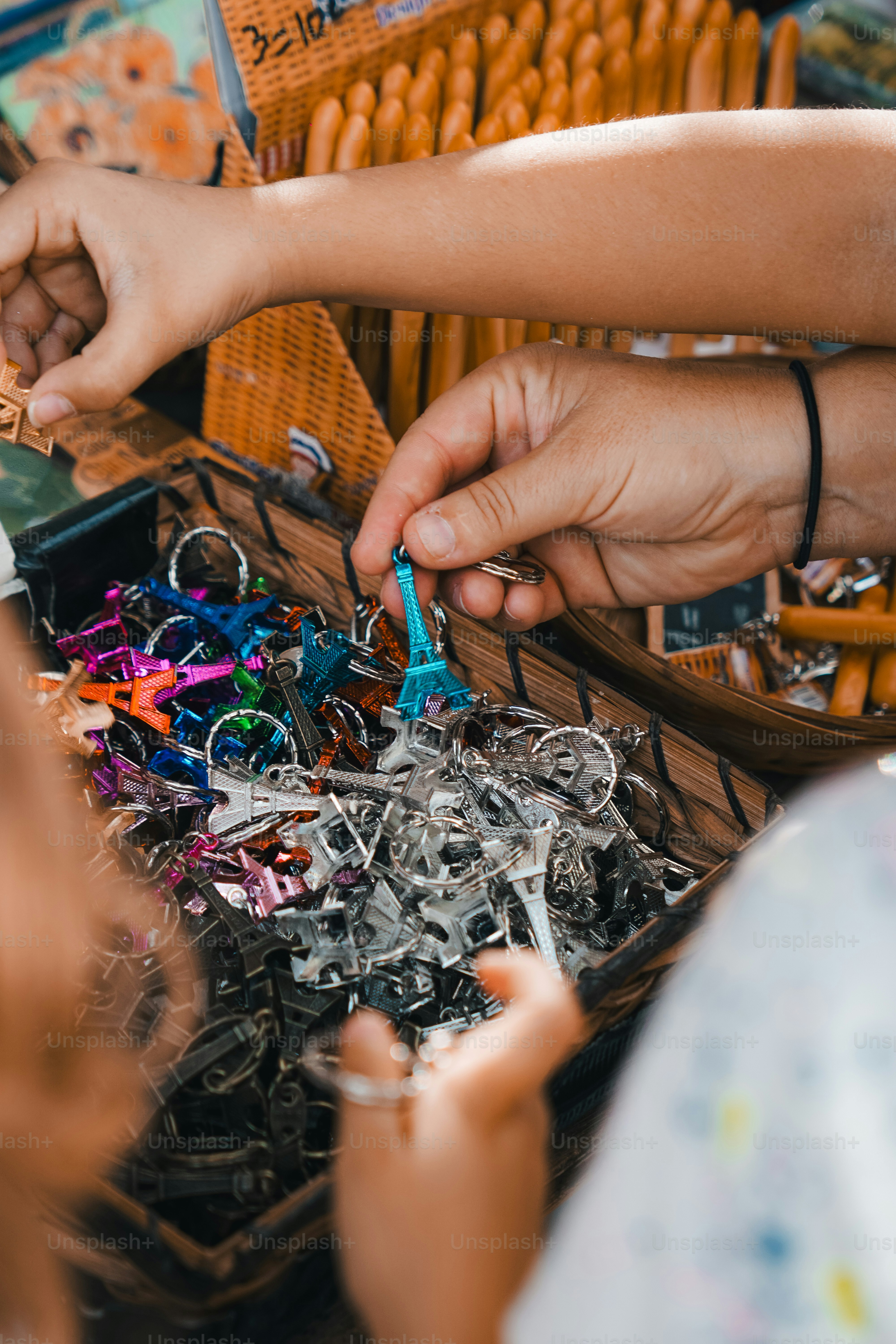 a person is putting a pair of scissors in a basket