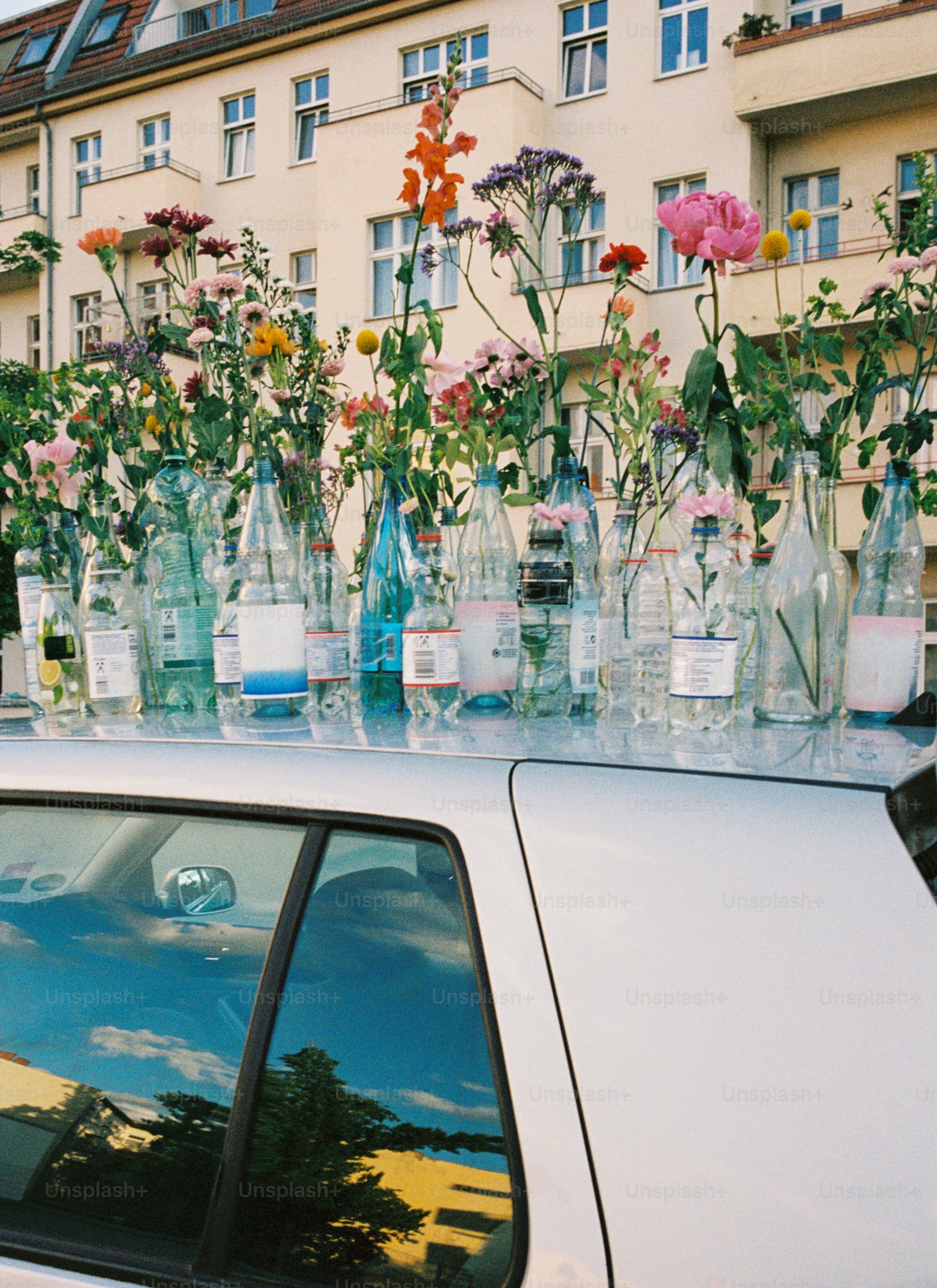 a white car parked in front of a building