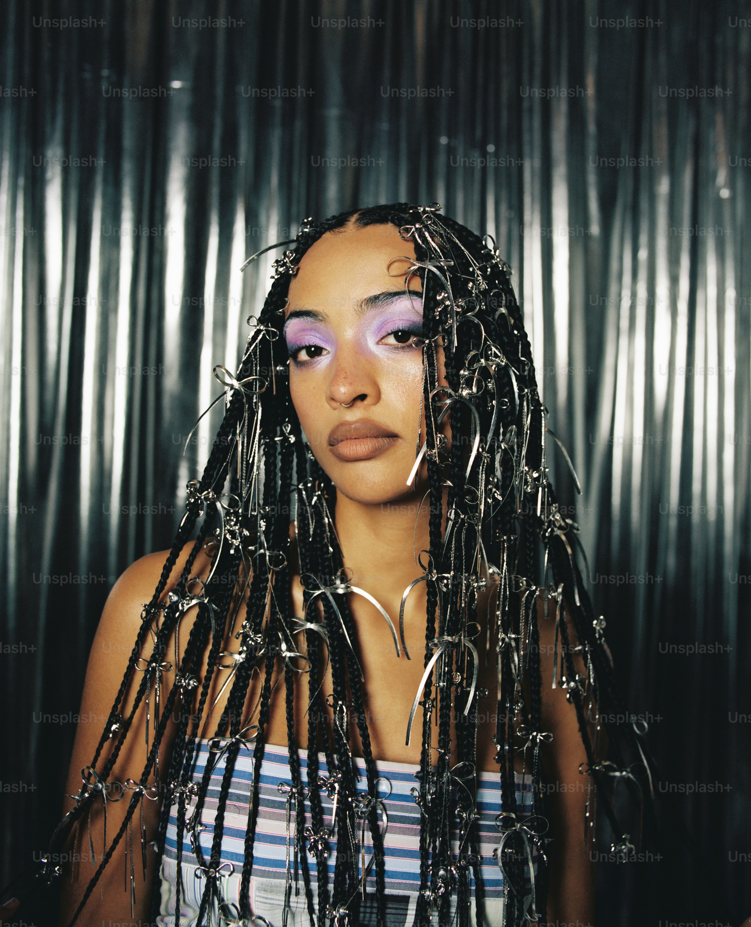 a woman with long hair and purple makeup