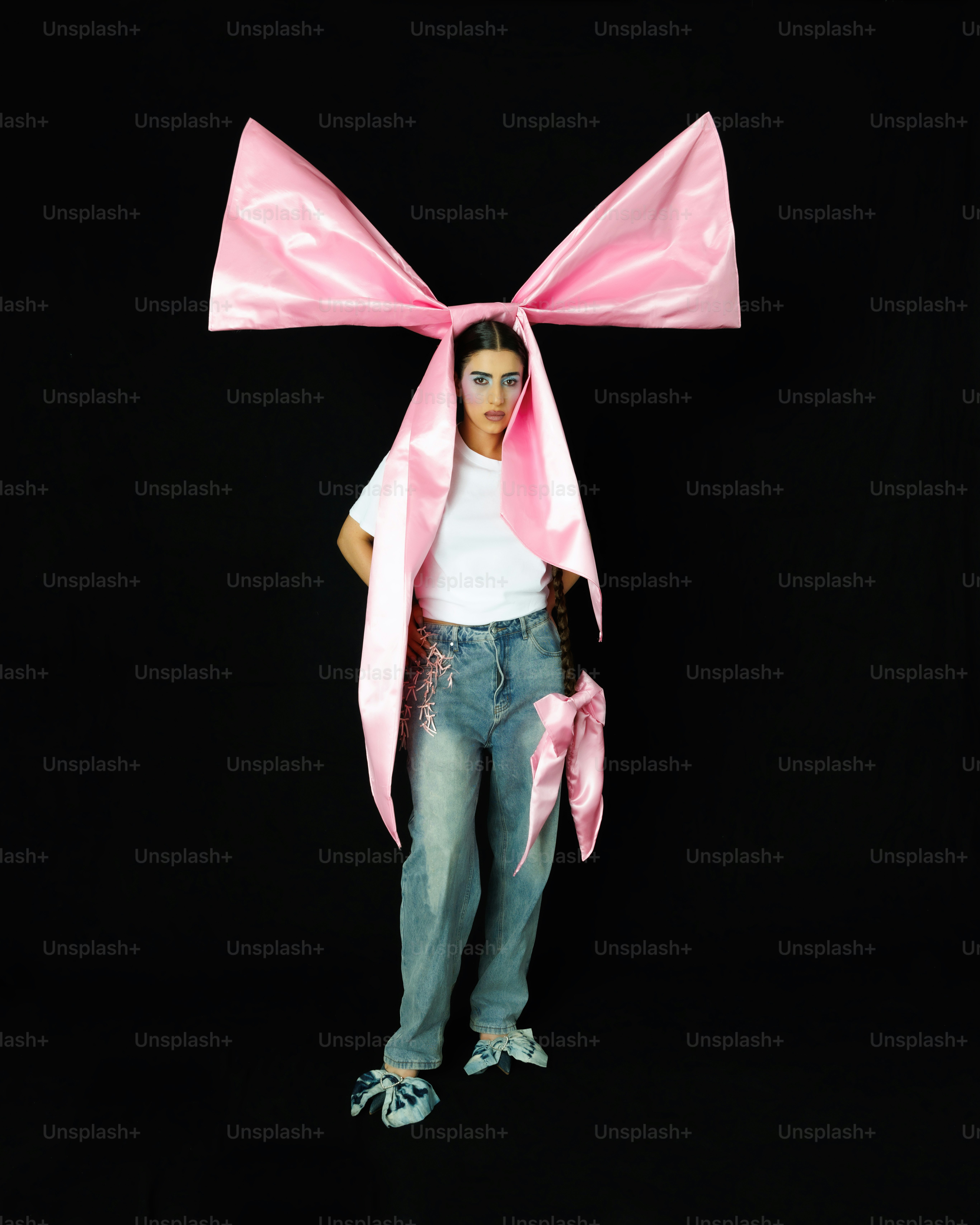 a woman with a pink bow on her head