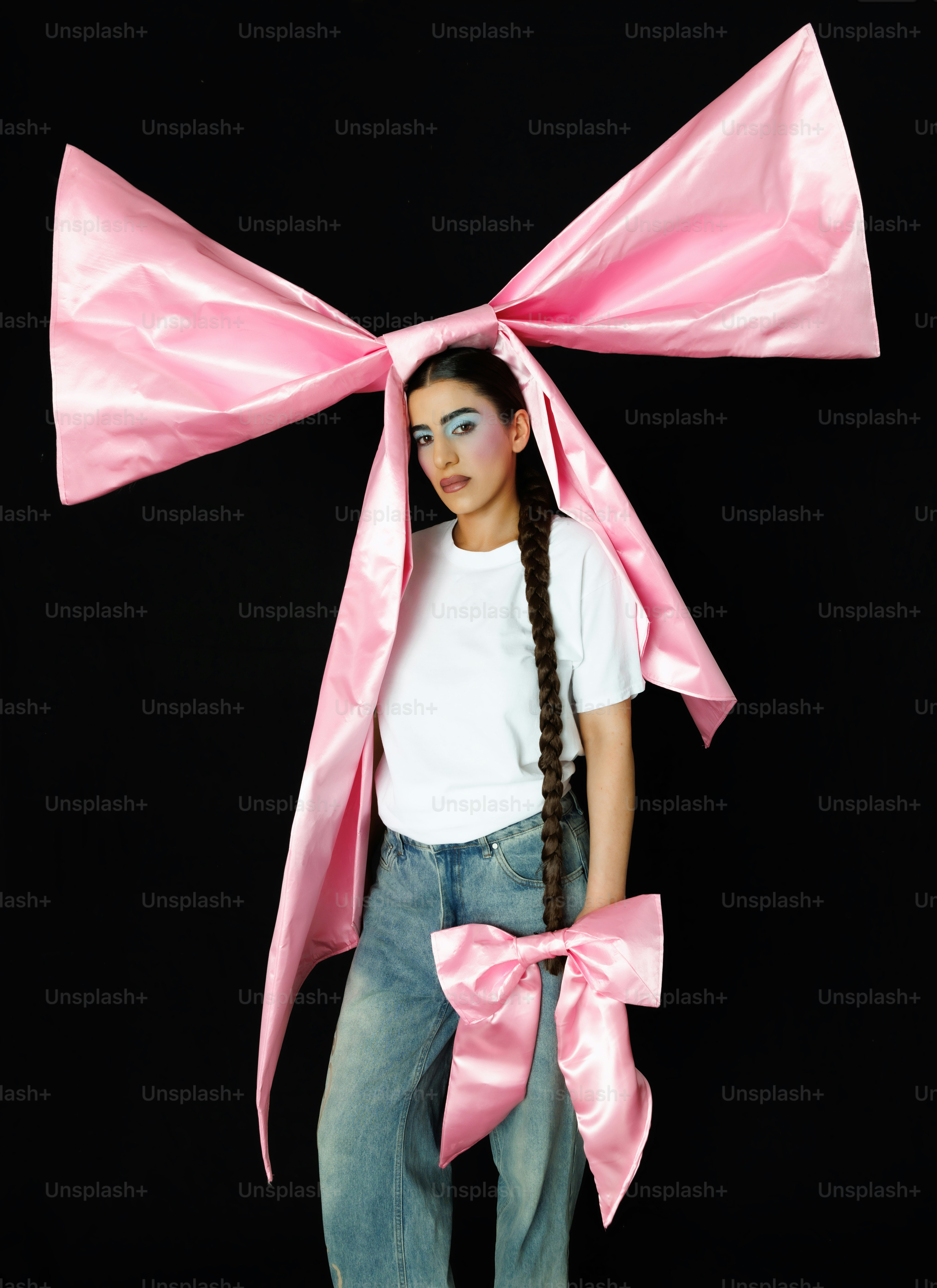 a woman with a pink bow on her head