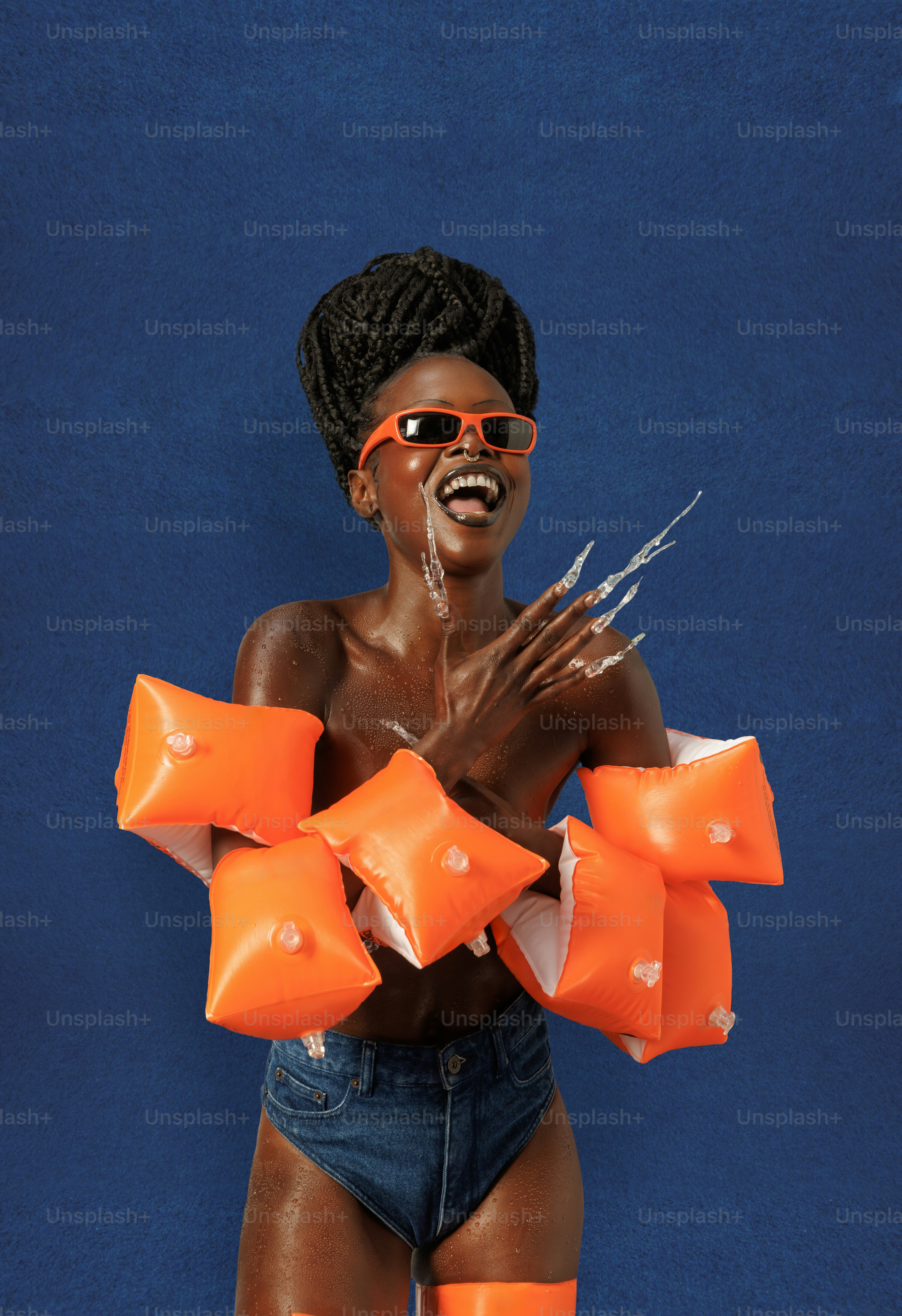 a woman in a bathing suit holding scissors in her hands