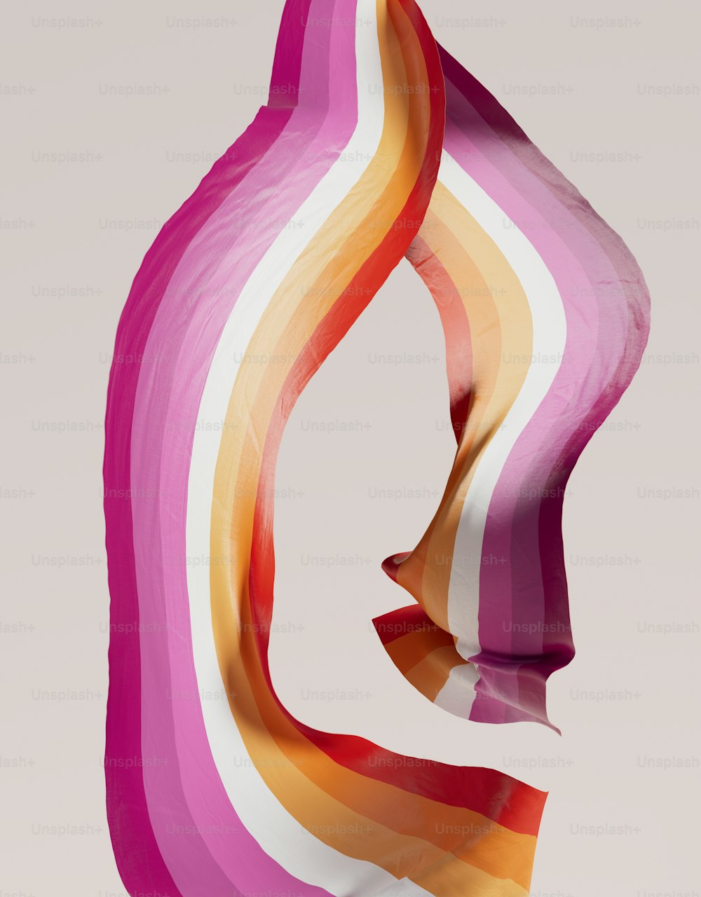 a woman's face with a multicolored scarf blowing in the wind