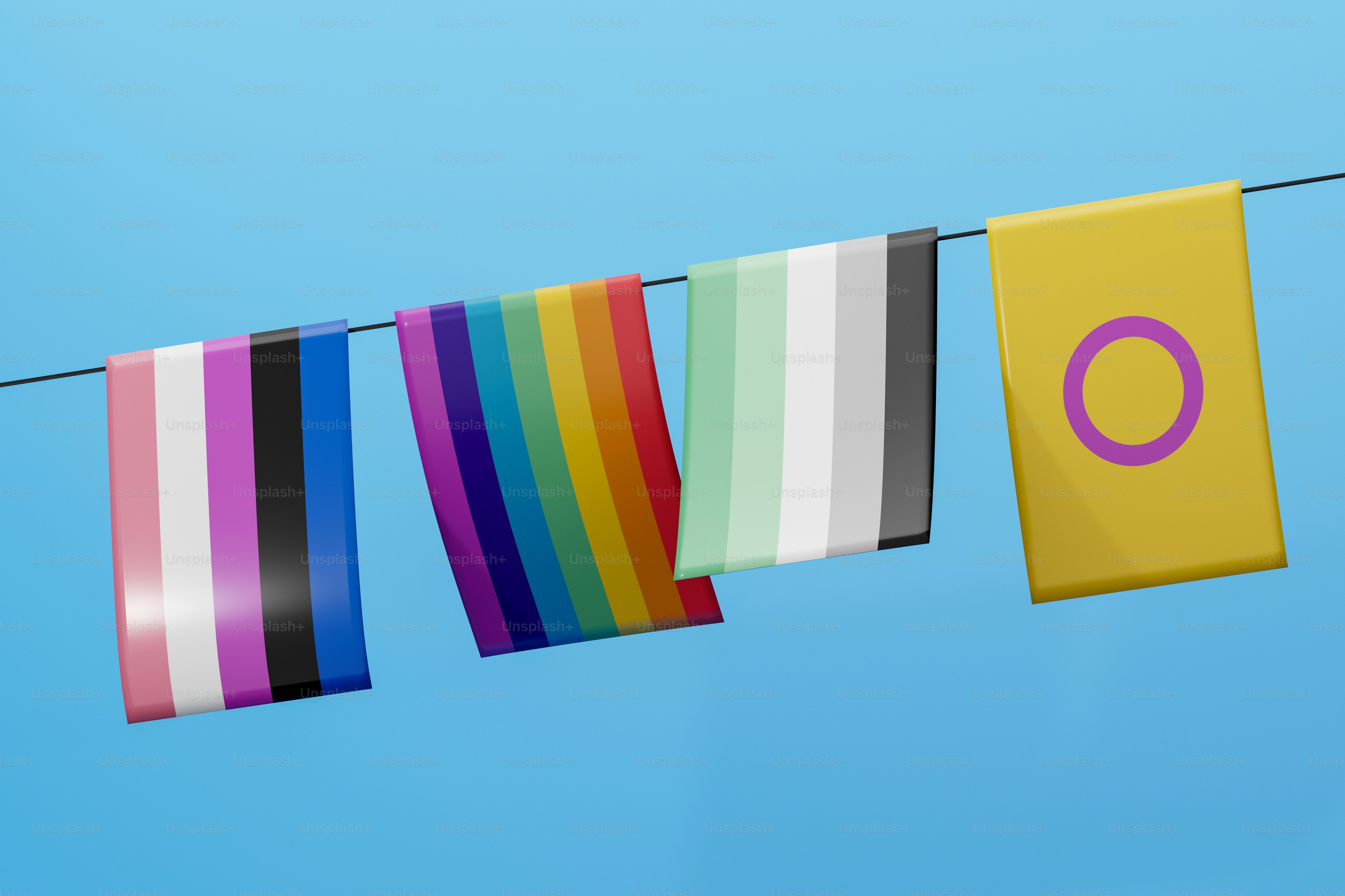 a row of colorful flags hanging from a clothes line