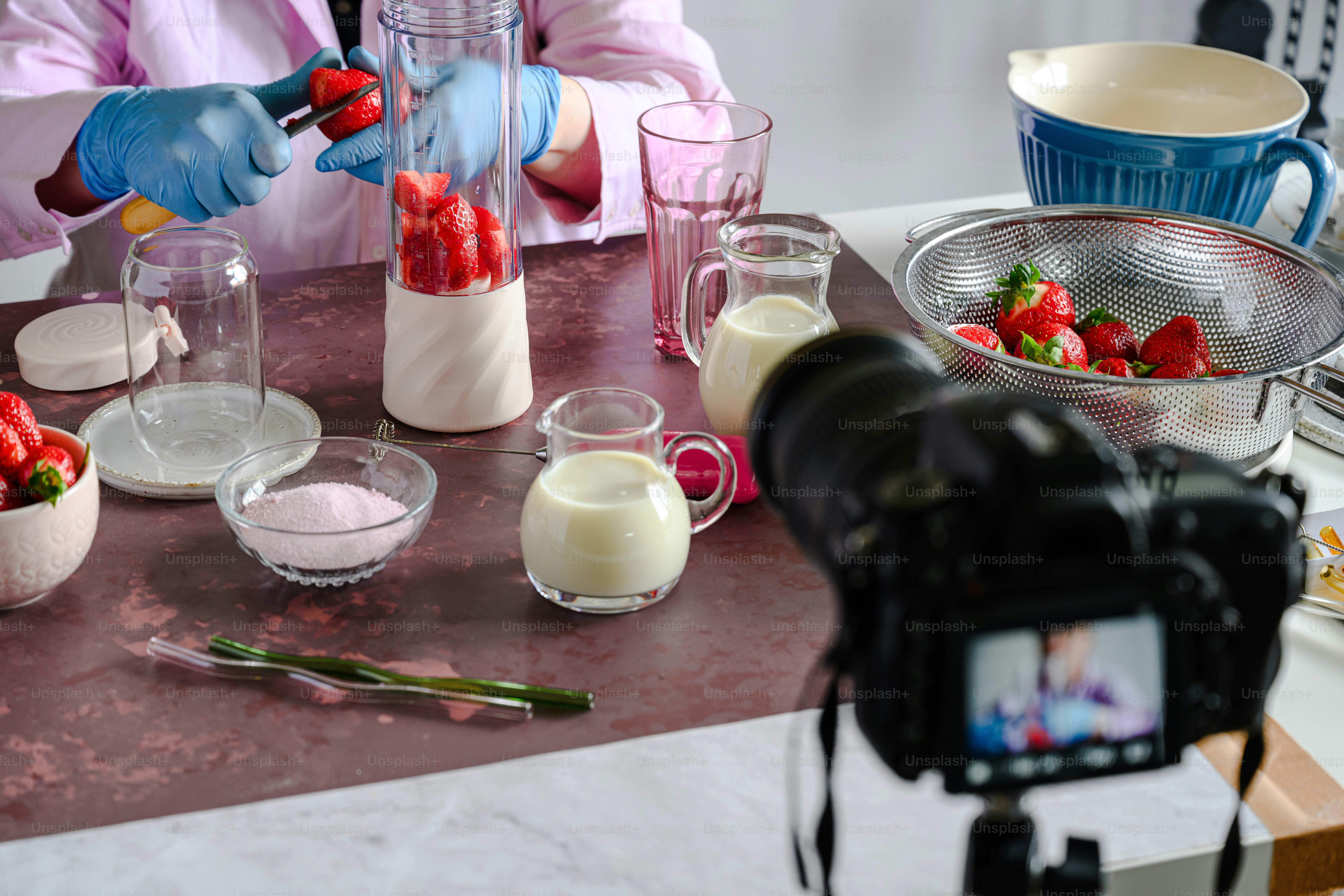a person in a pink shirt is making food