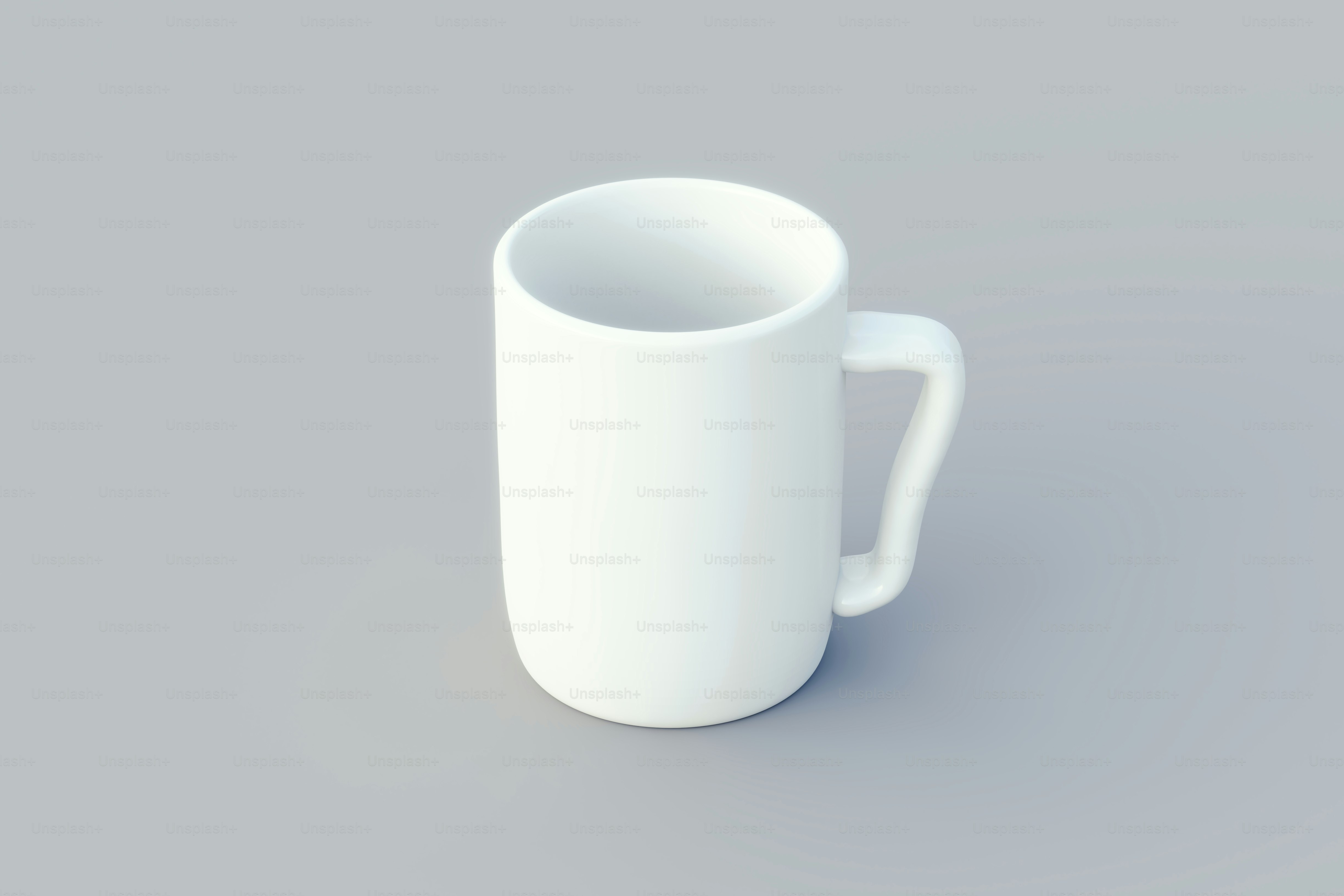a white coffee cup sitting on top of a table