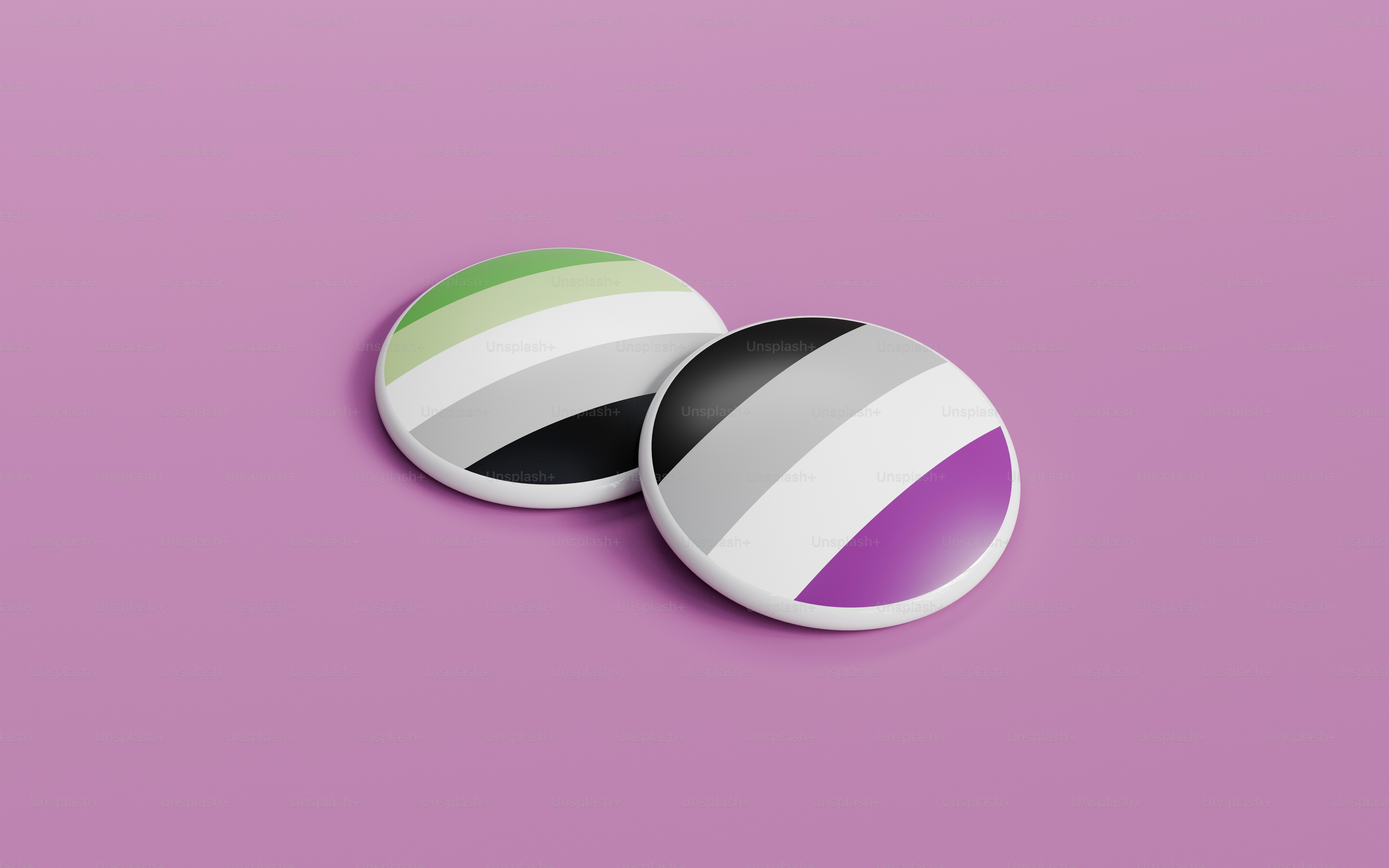 a pair of black, white, and green buttons on a purple background