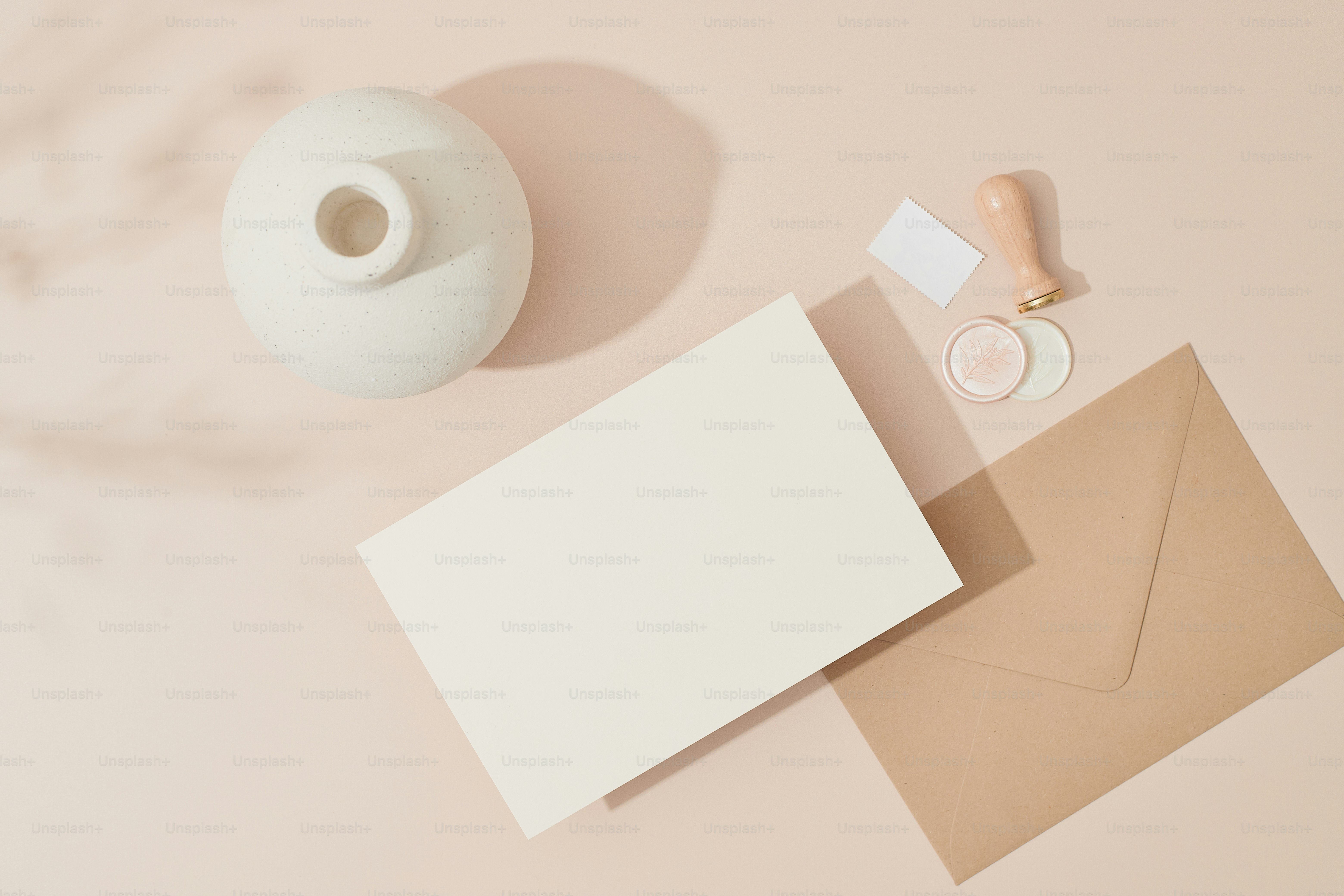a white vase and some cards on a table