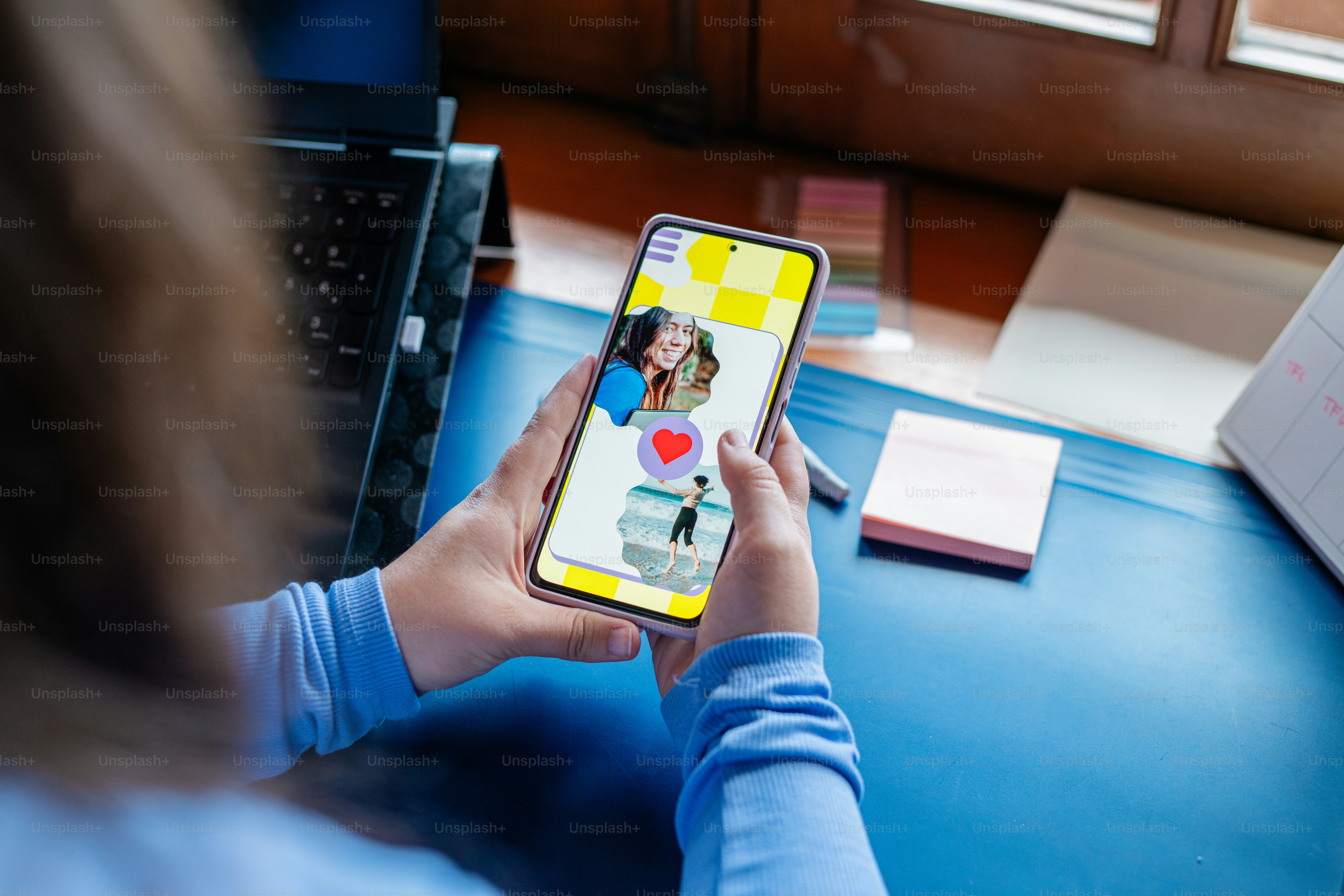 a person holding a cell phone with a picture on it