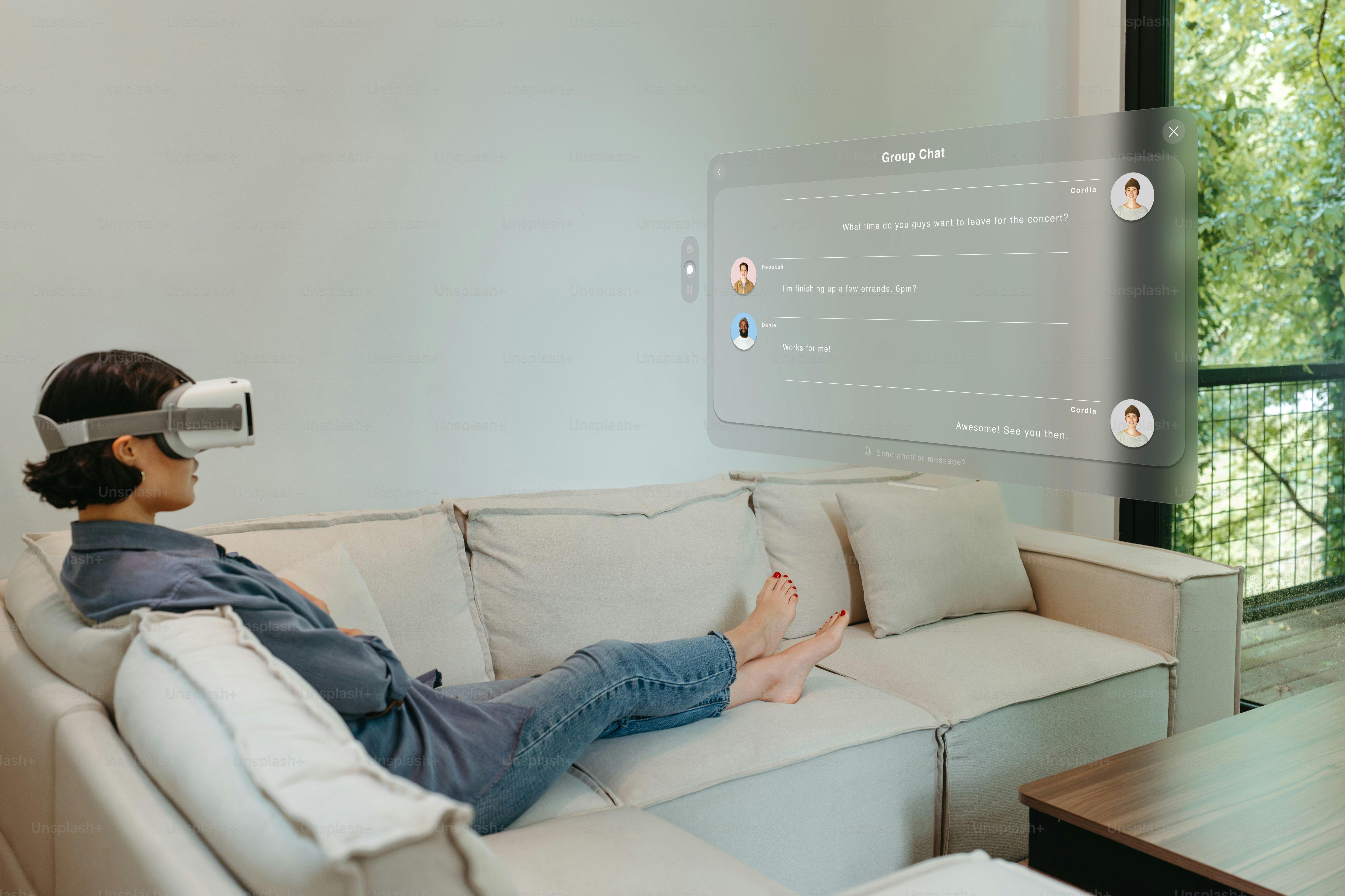 A person sitting on a sofa chatting with a humanoid AI assistant displayed on a holographic screen, surrounded by smart home devices in a cozy modern room.