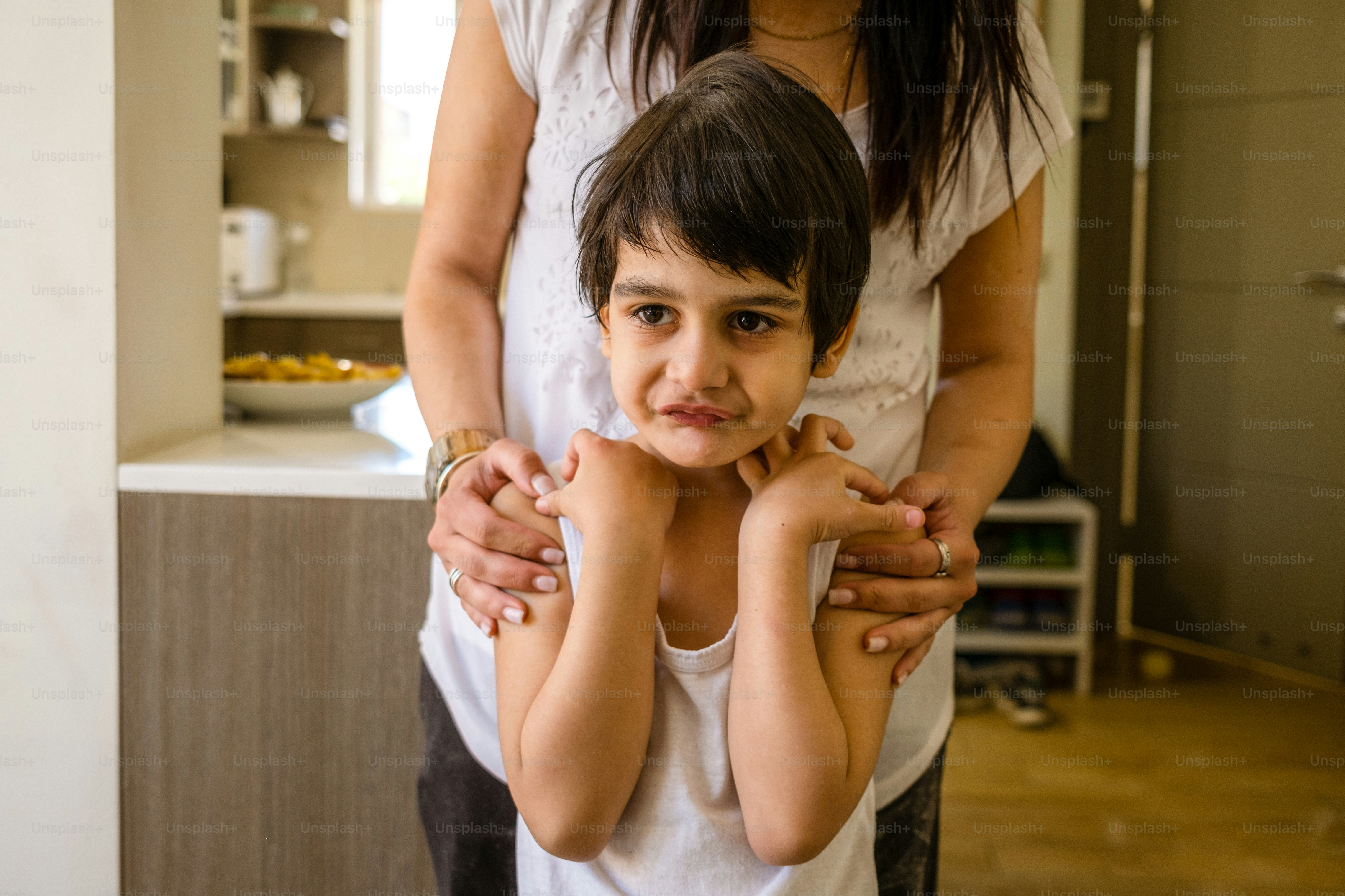 a woman holding a small child in her arms