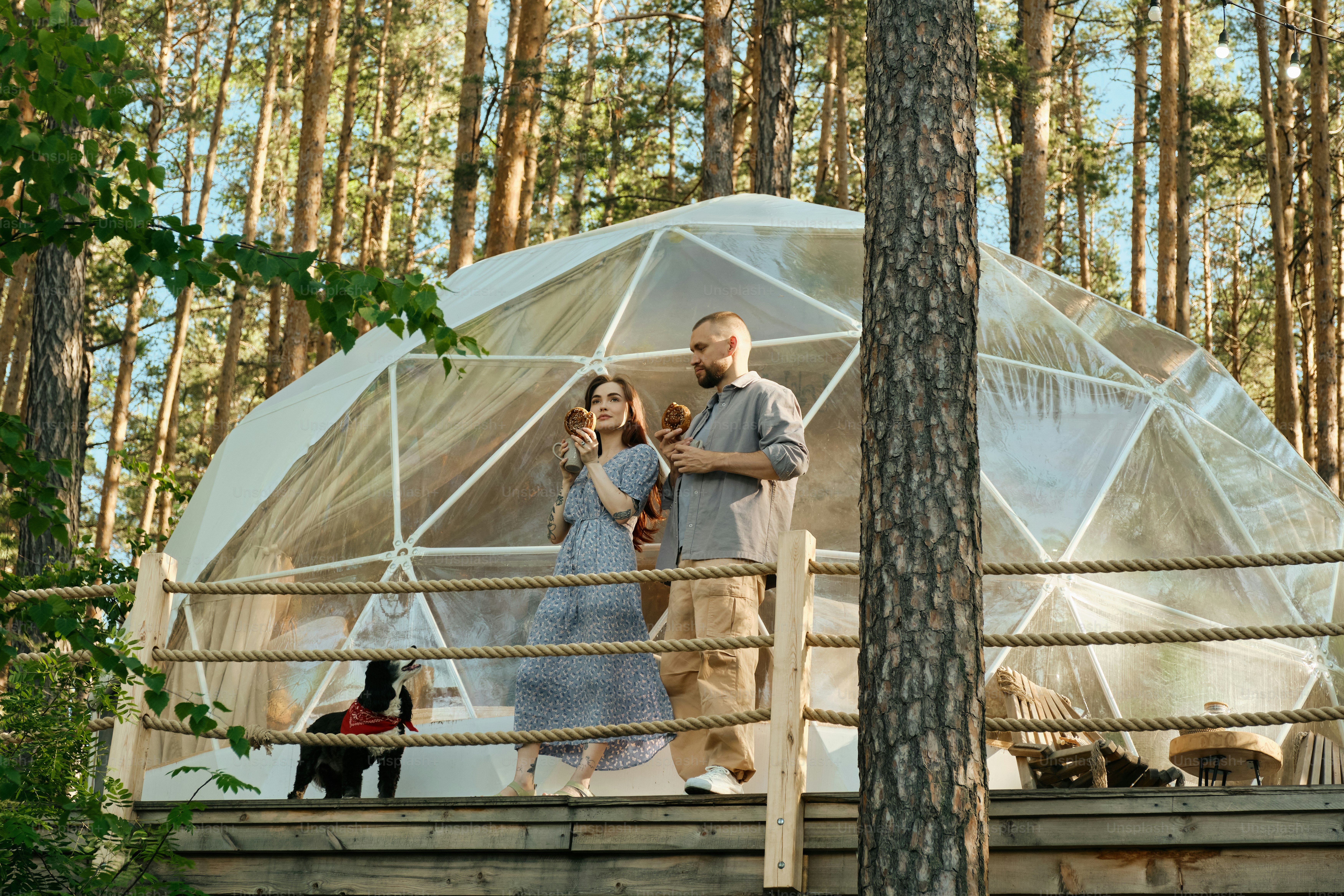 a man and a woman walking across a bridge
