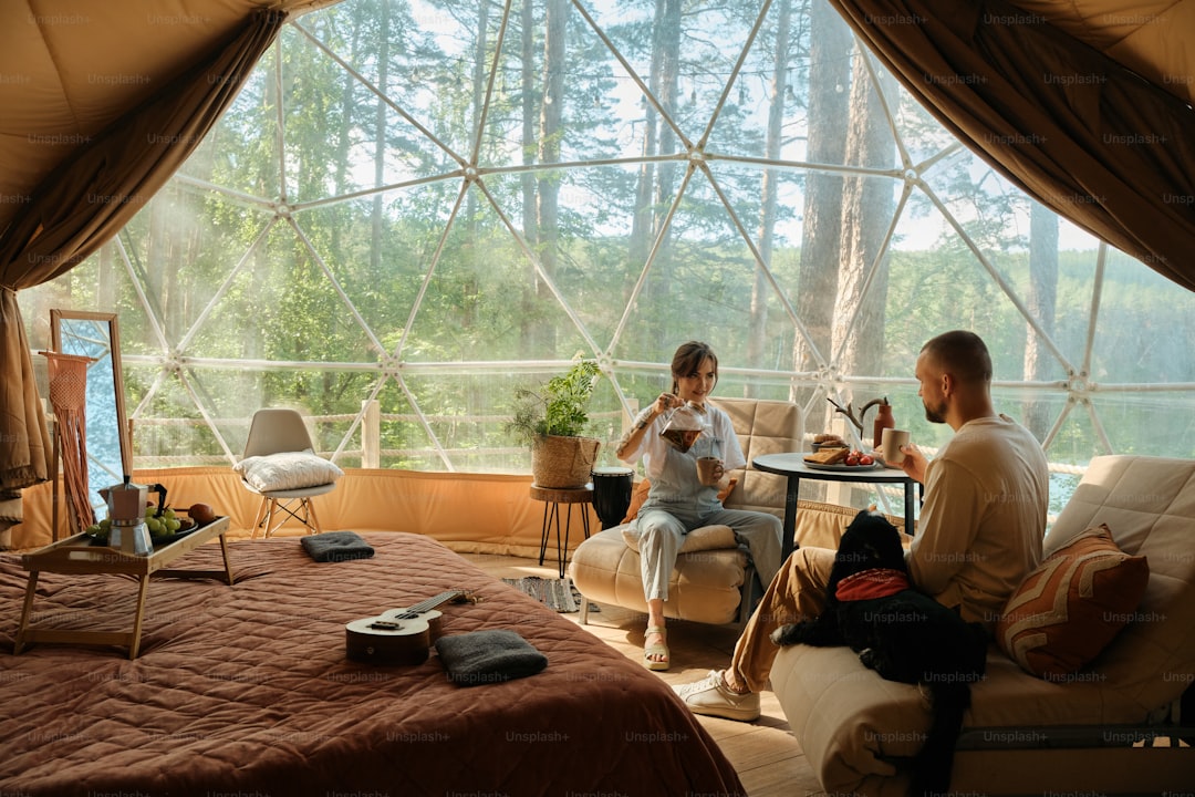 a couple of people that are sitting in a tent