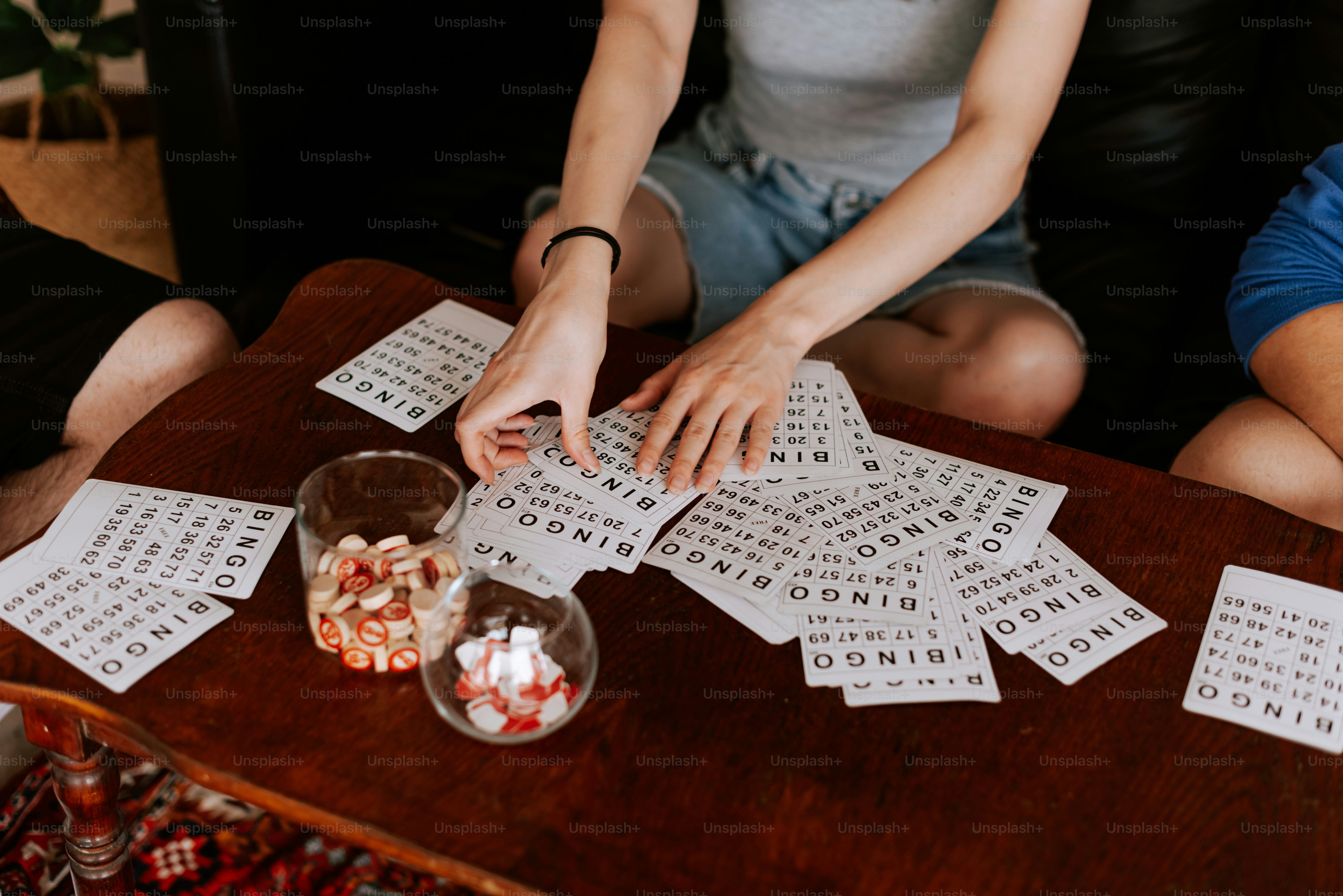 a group of people sitting around a wooden table