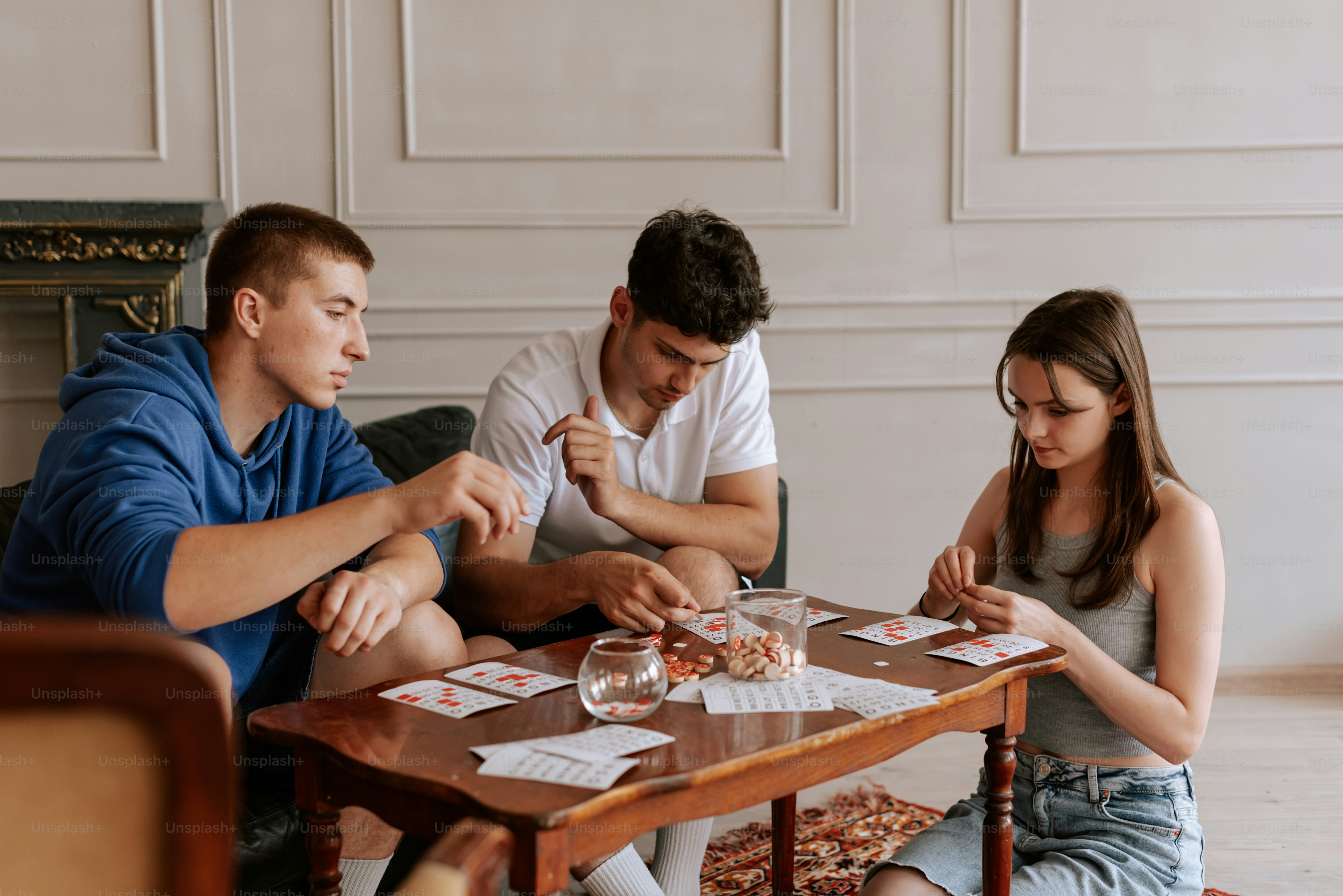 a group of people sitting around a wooden table