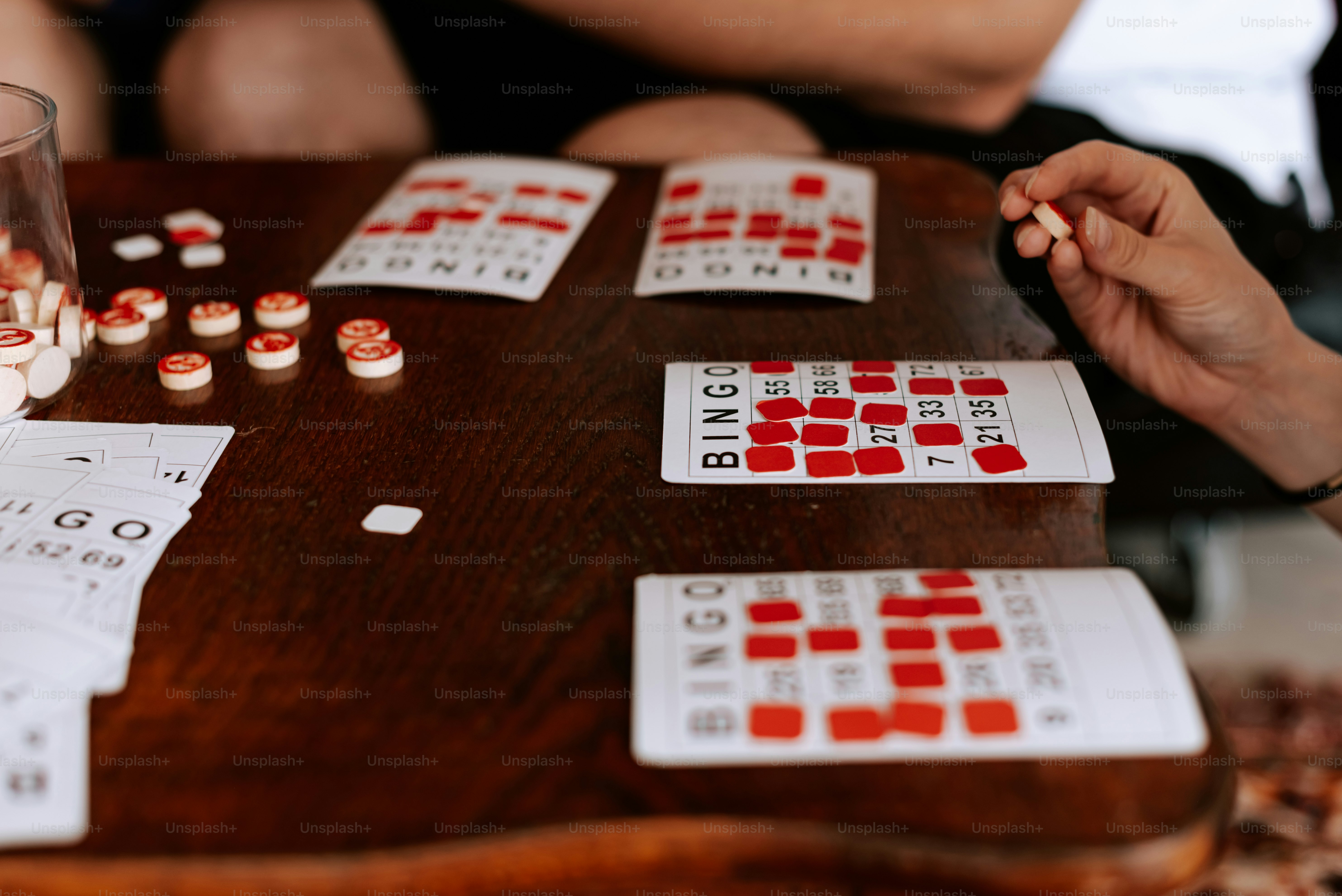 a close up of a person playing a game of dominos
