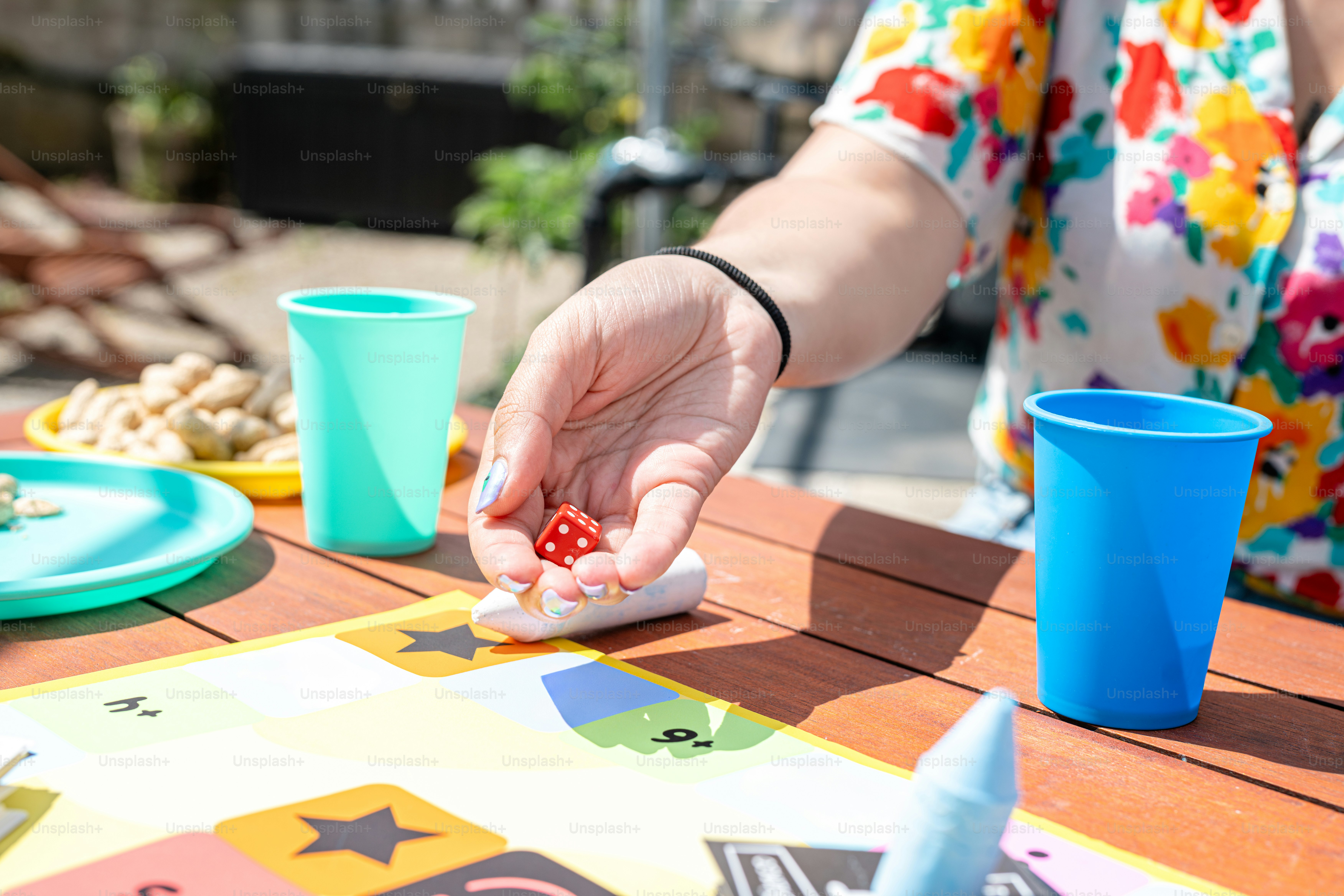 a woman playing a game of dice on a table