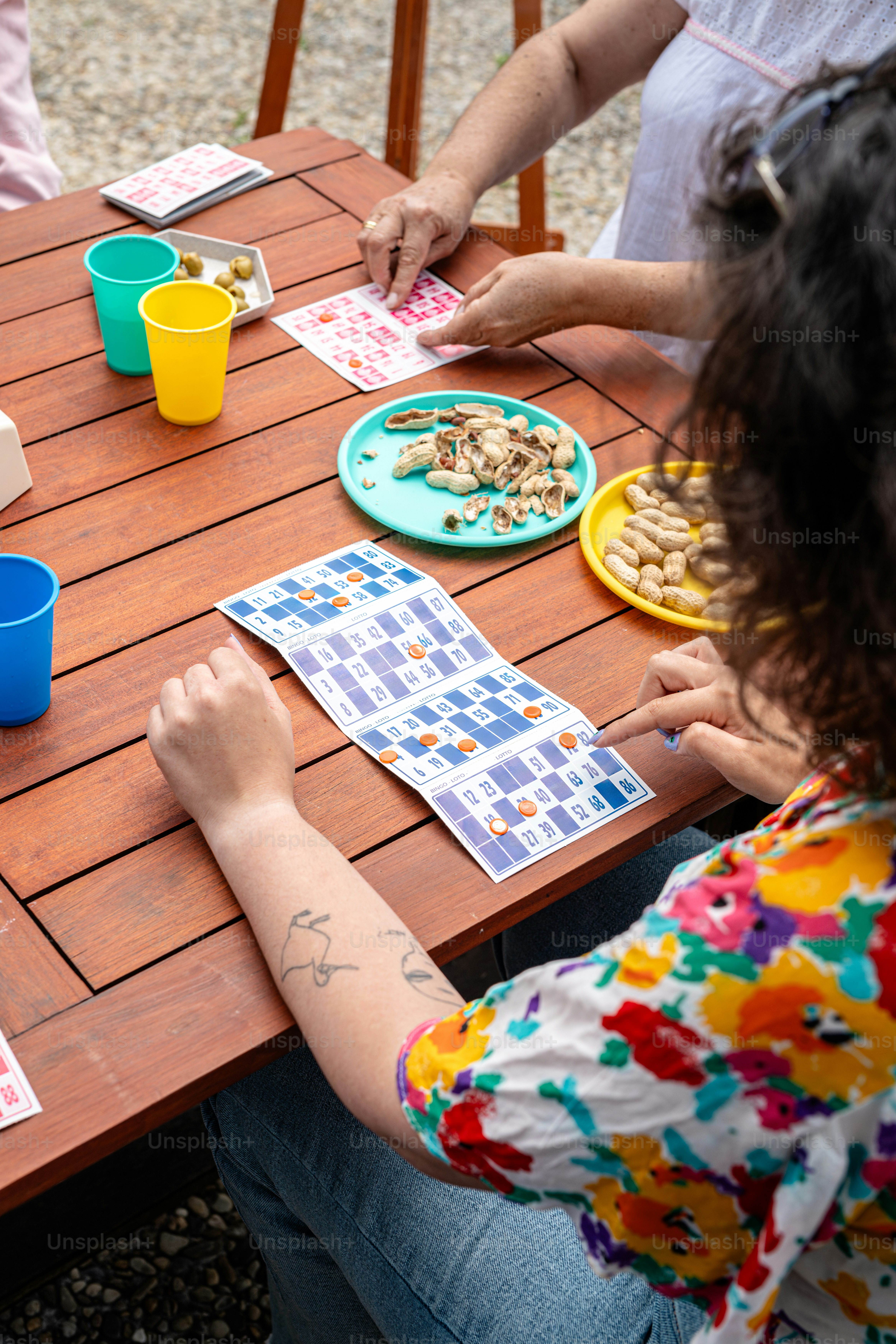 a group of people sitting around a wooden table