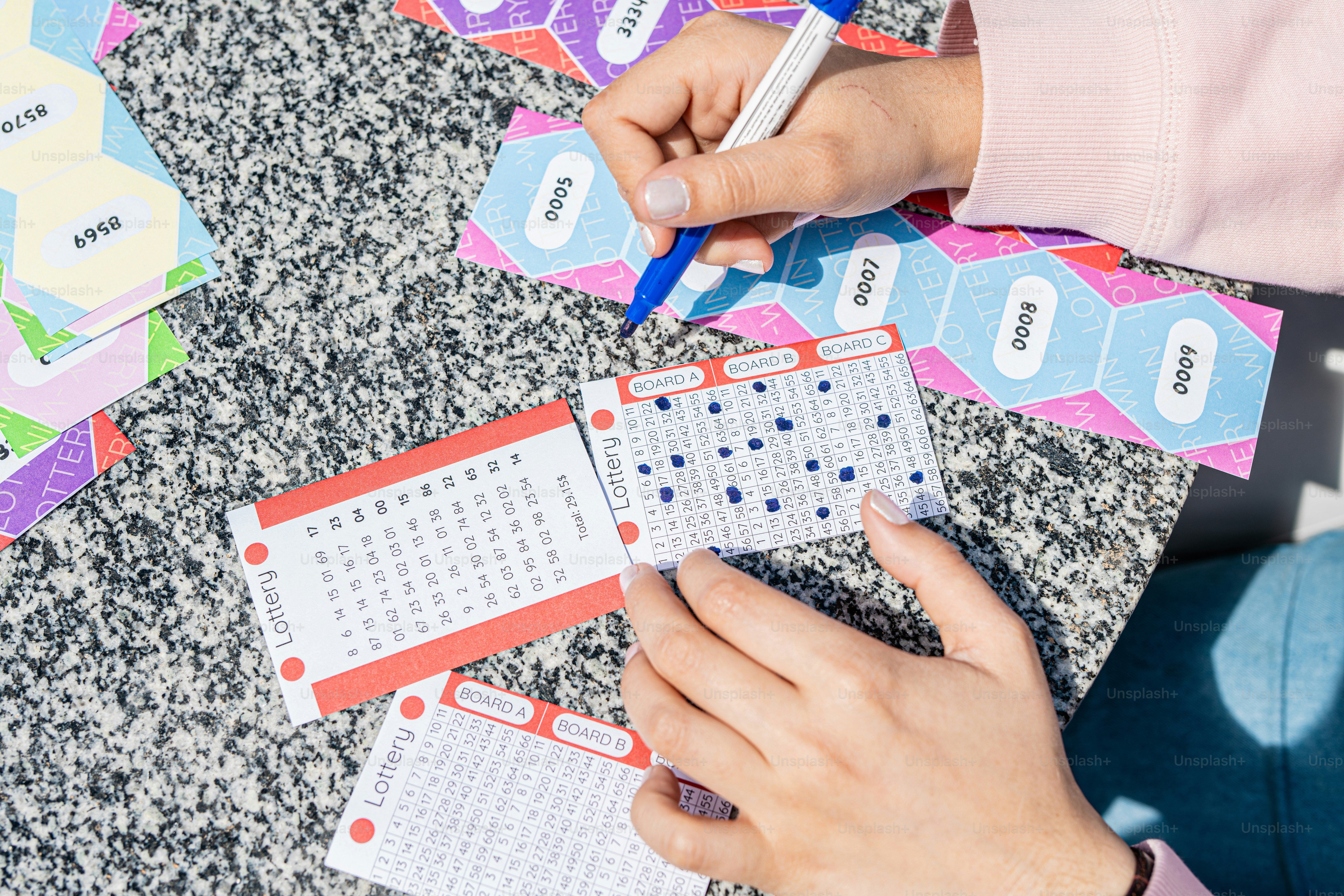 a person is writing on a piece of paper