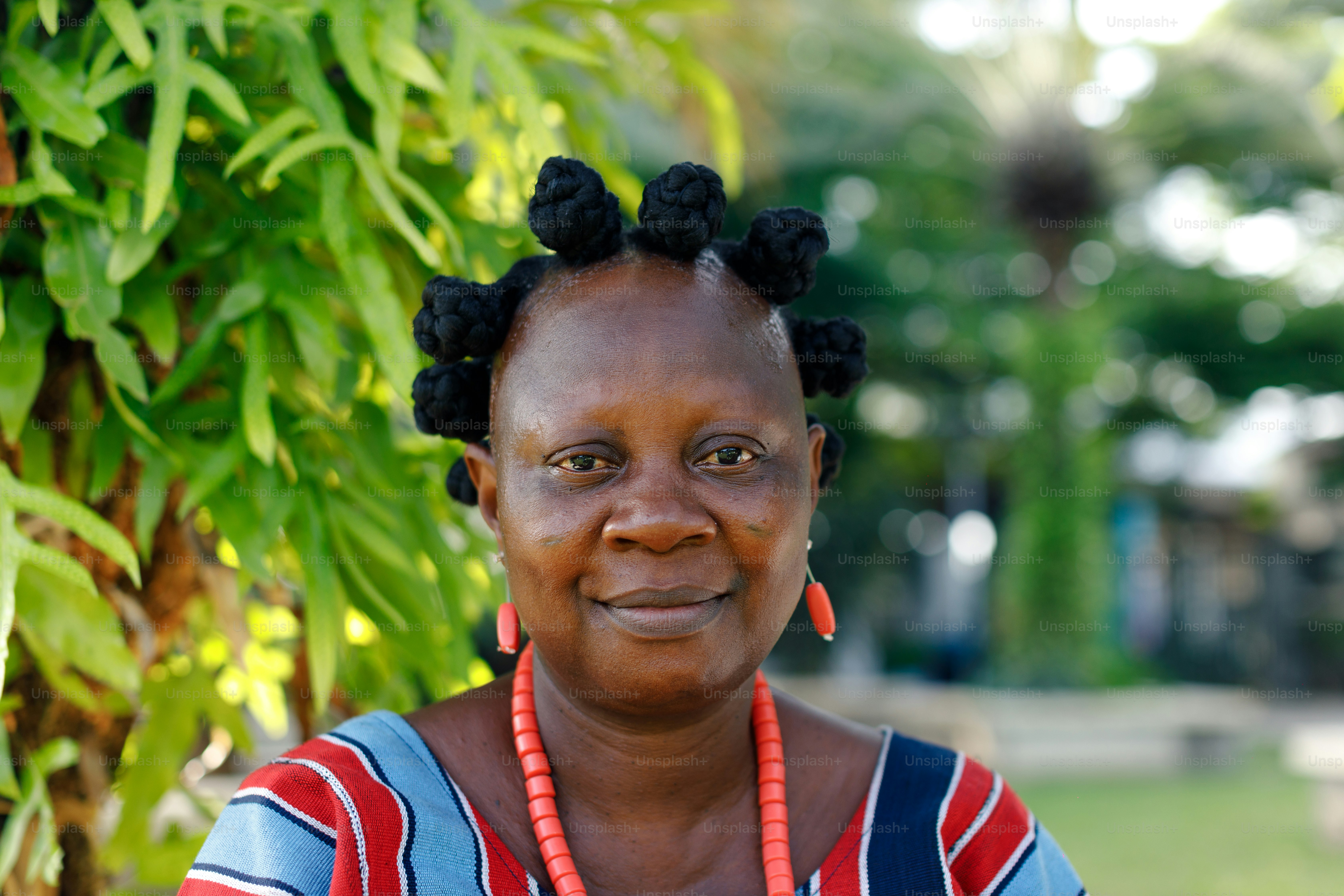a woman wearing a necklace and a necklace with flowers on it