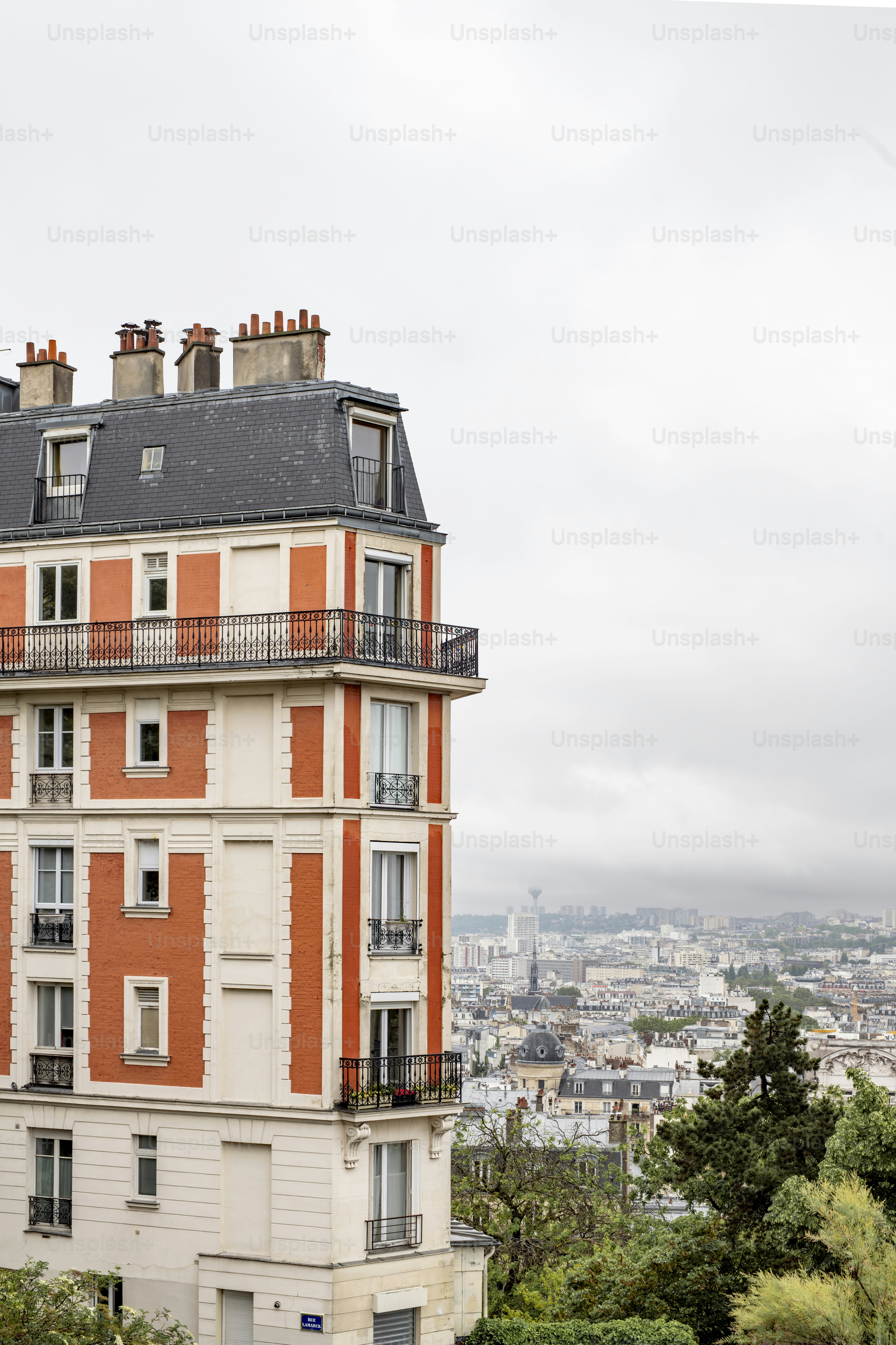an orange and white building with a balcony and balconies