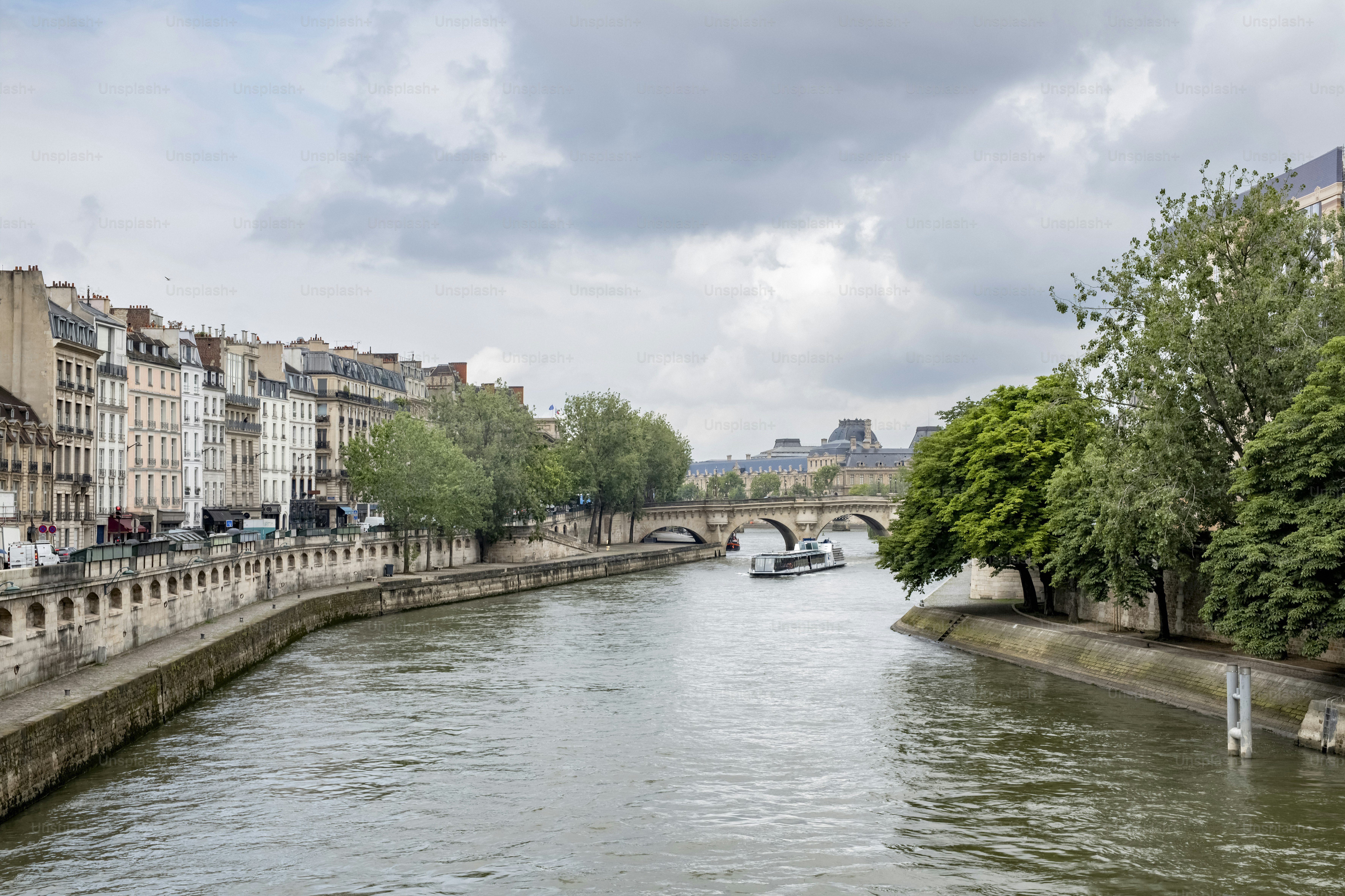 a river running through a city next to tall buildings