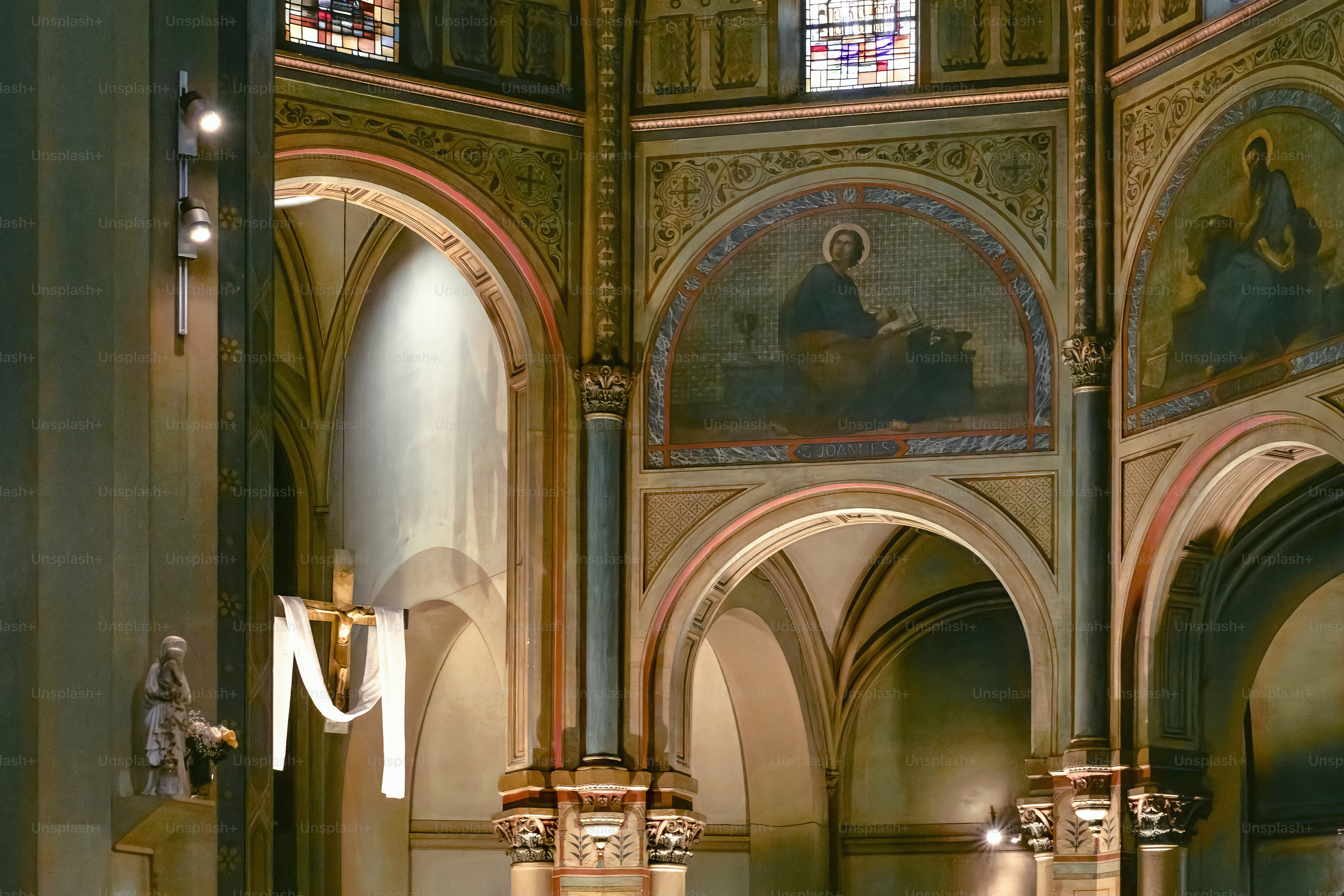 the interior of a church with stained glass windows