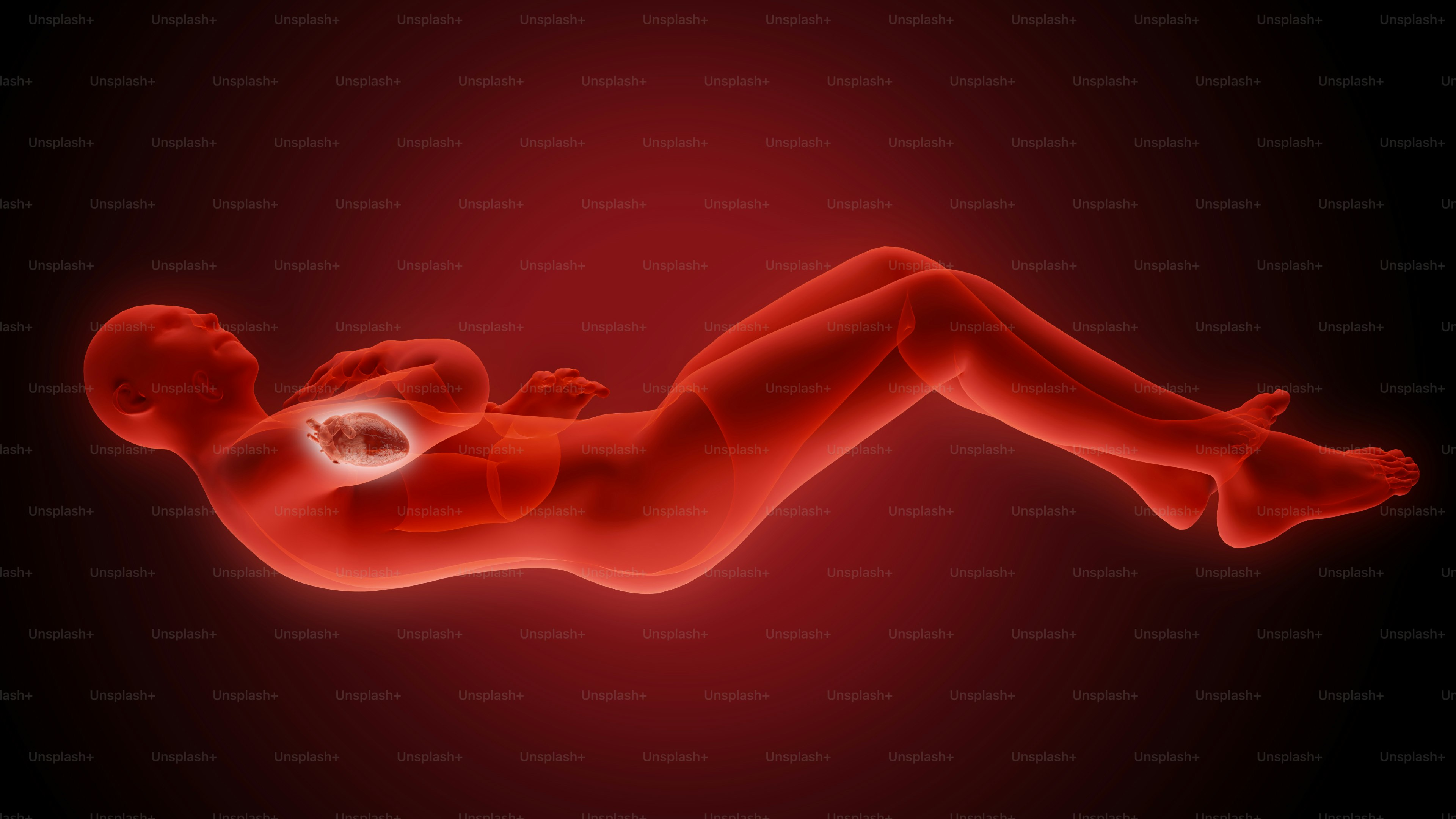 a woman laying down on her stomach with a cell phone in her hand