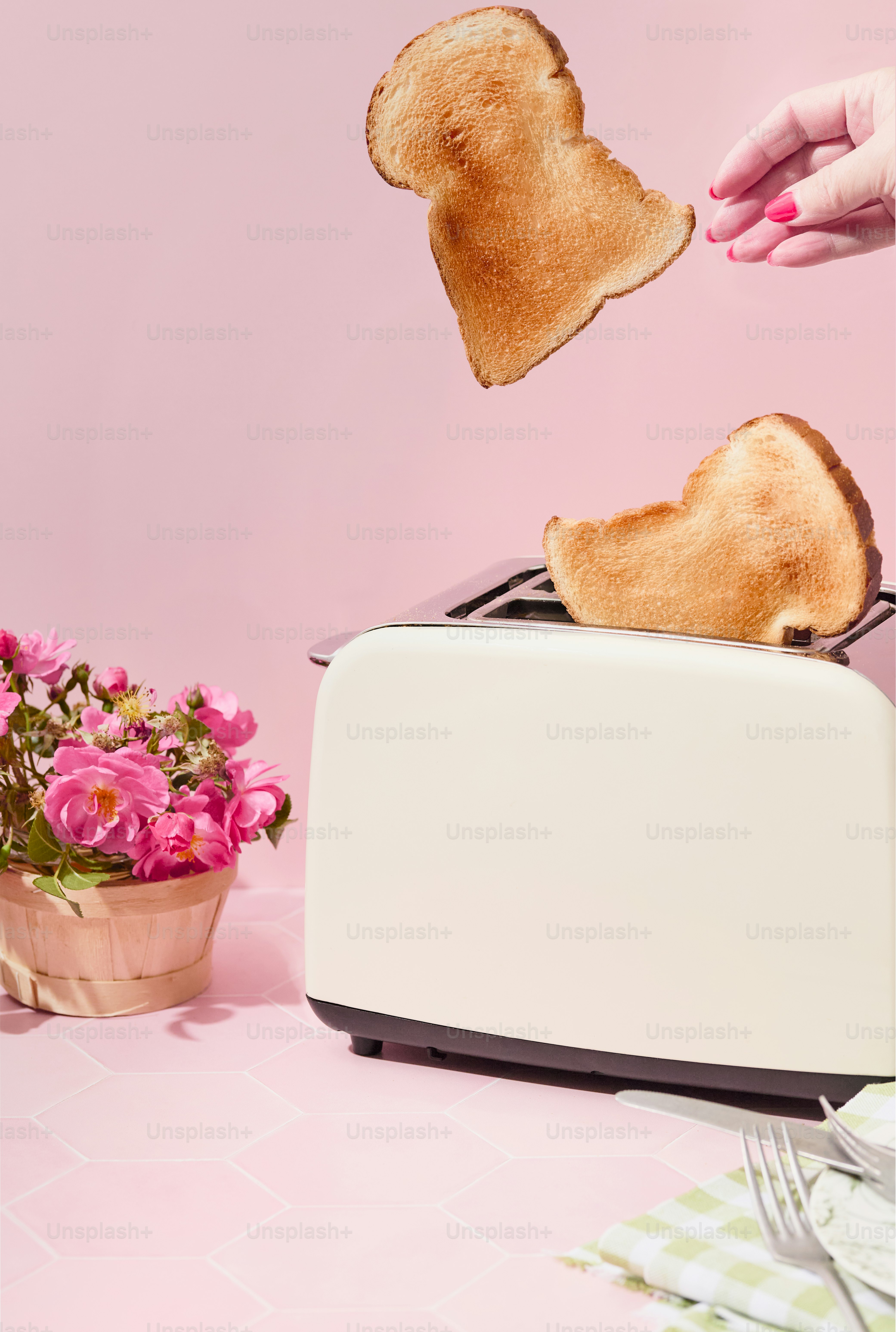 a toaster with two pieces of bread sticking out of it